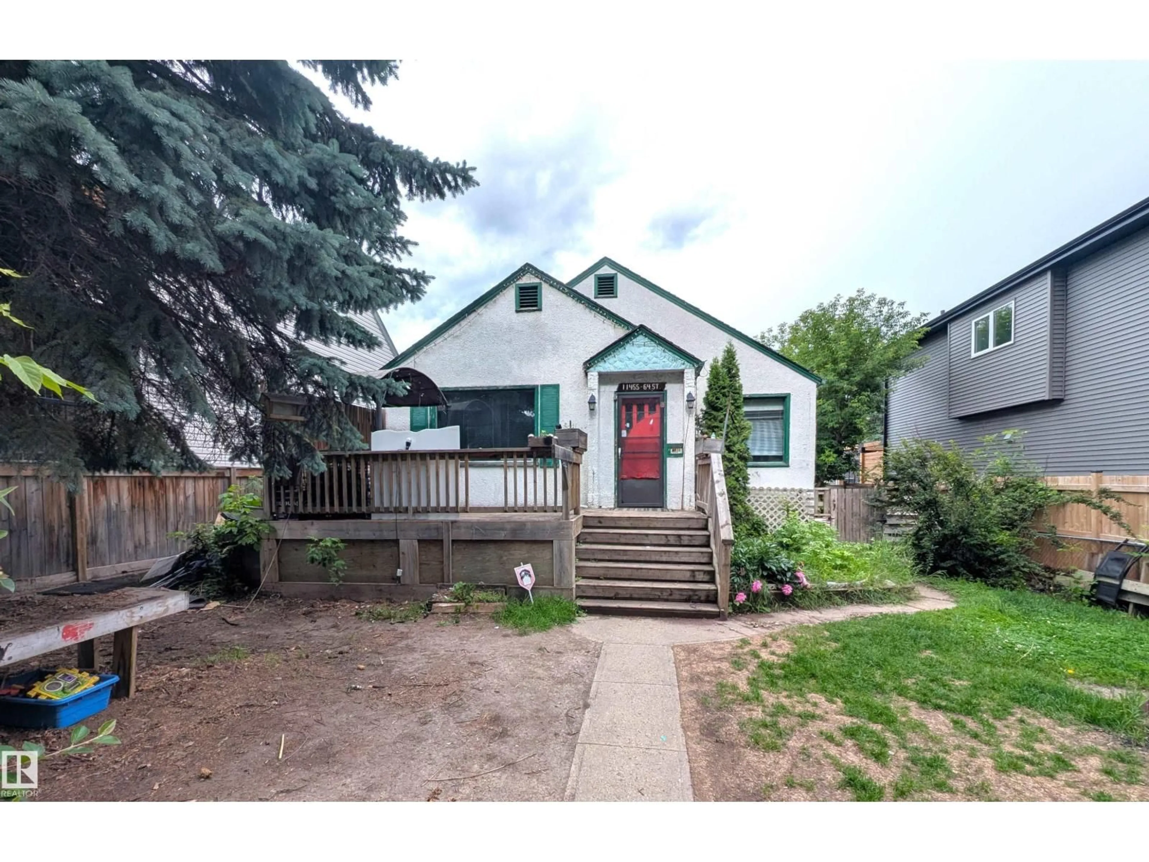 Home with vinyl exterior material, street for 11455 64 ST, Edmonton Alberta T5W4H8