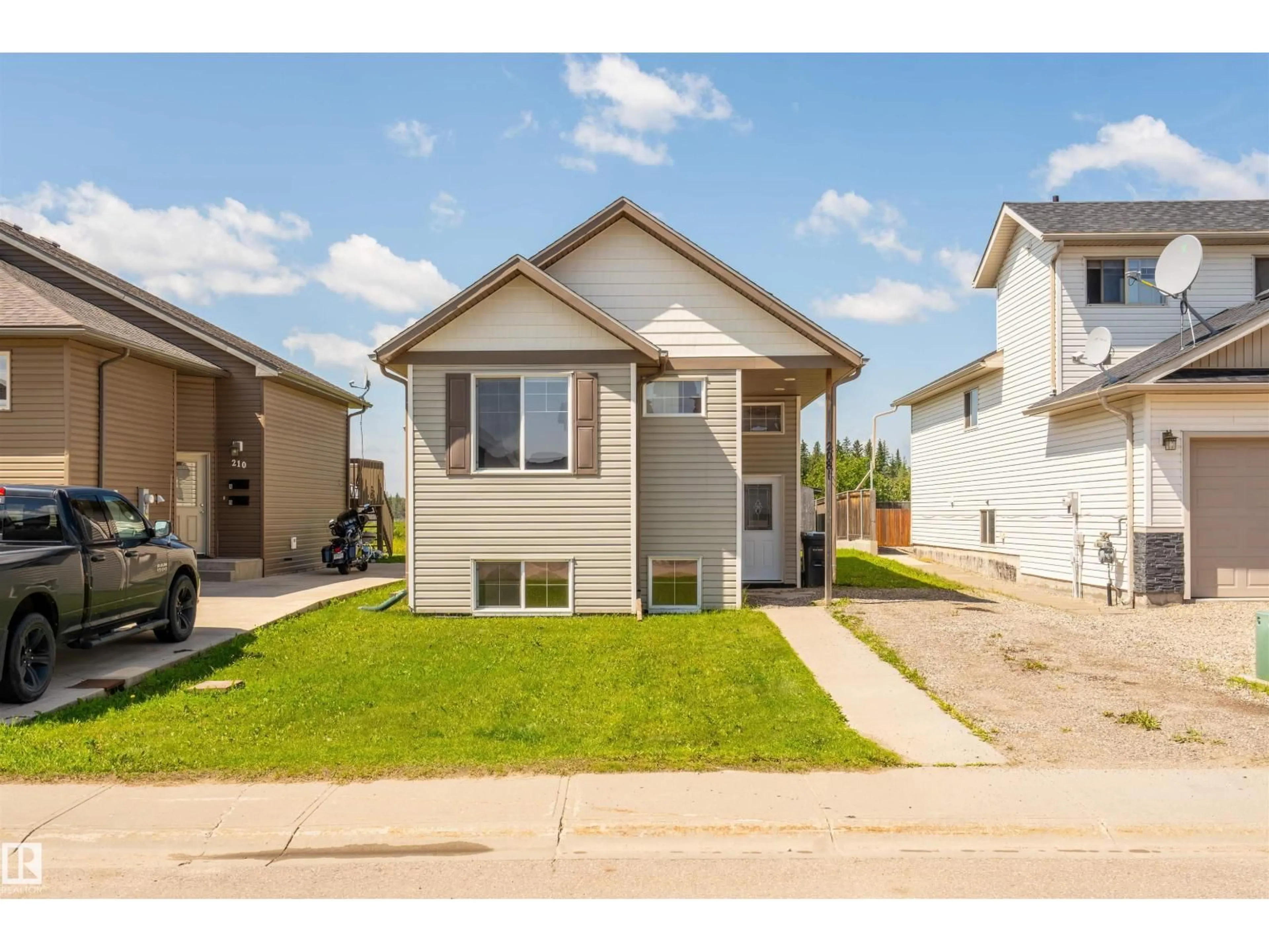 Home with vinyl exterior material, street for 208 26 ST, Cold Lake Alberta T9M0E3