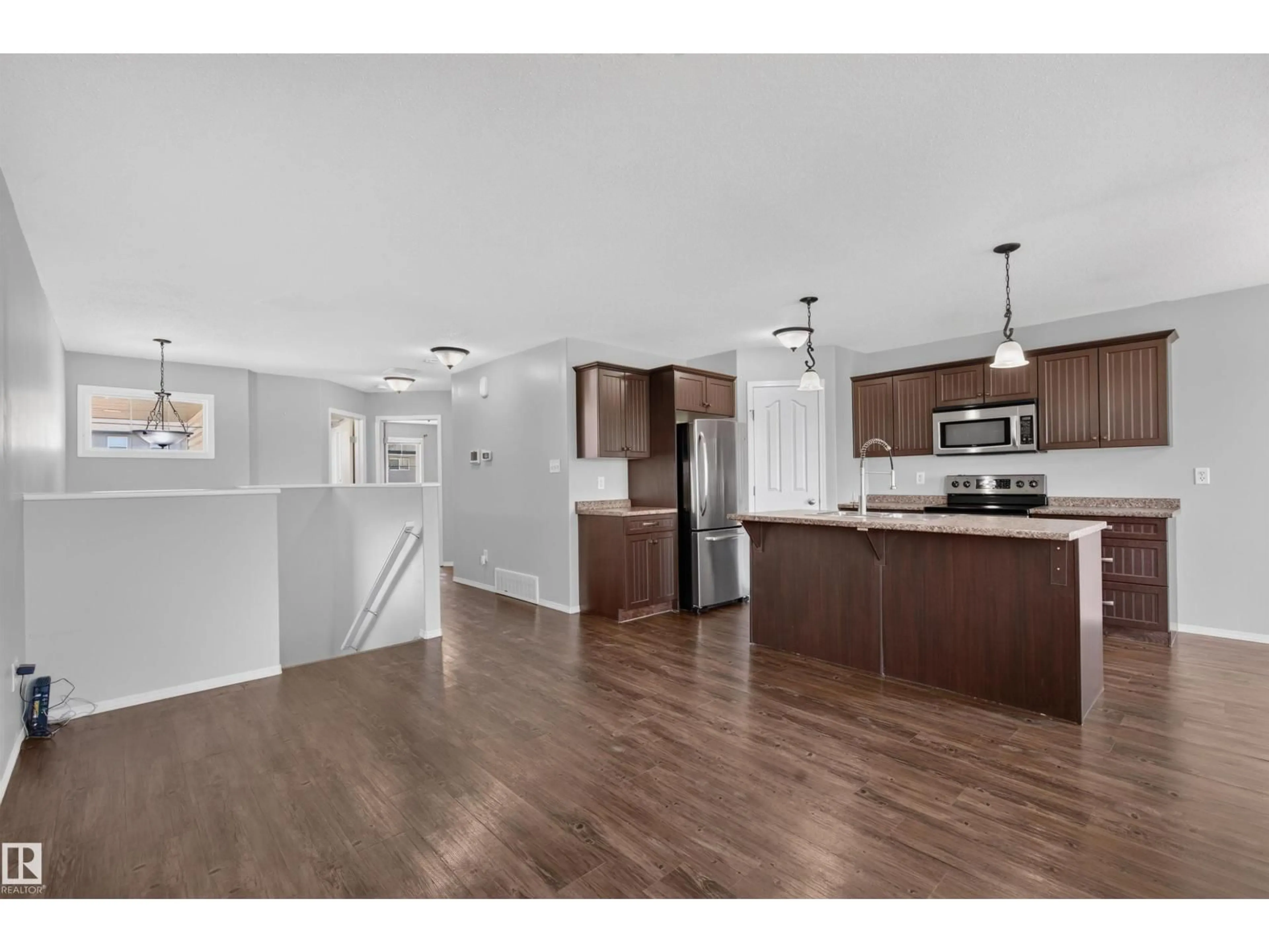 Open concept kitchen, wood/laminate floor for 208 26 ST, Cold Lake Alberta T9M0E3
