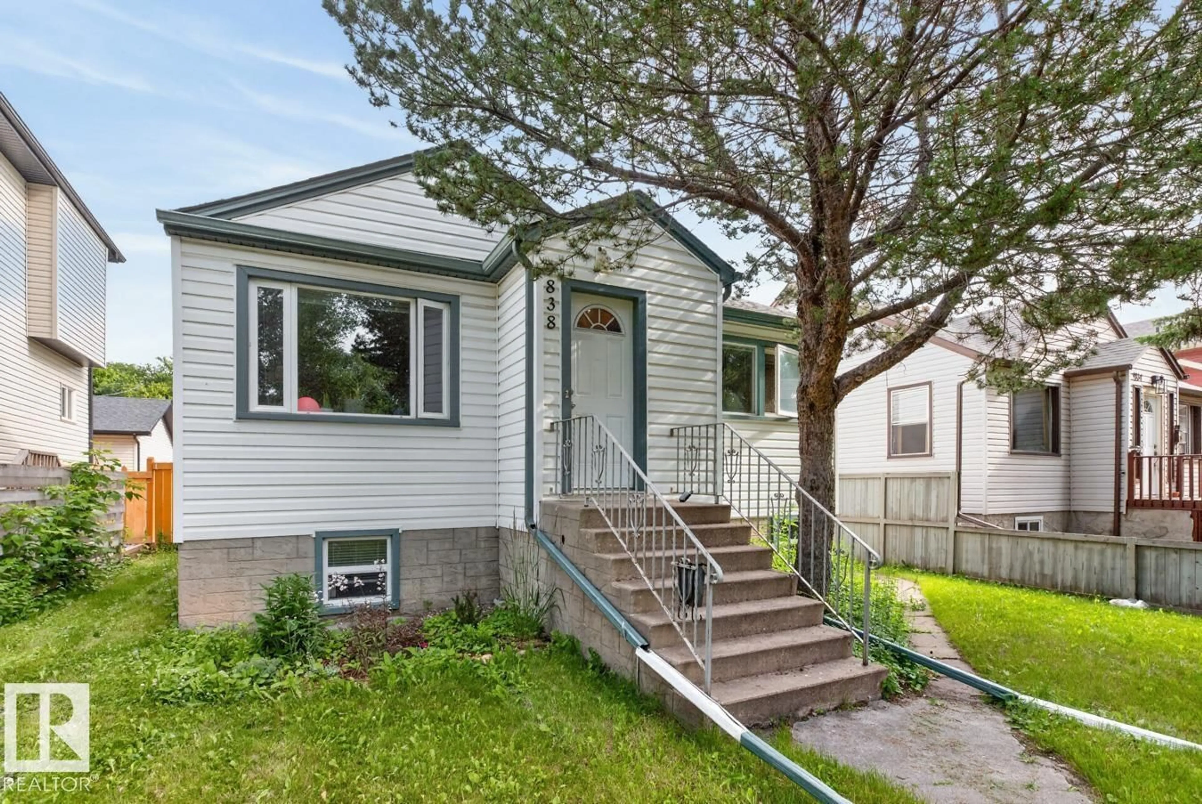 Home with vinyl exterior material, street for NW - 9838 80 AV, Edmonton Alberta T6E1T1