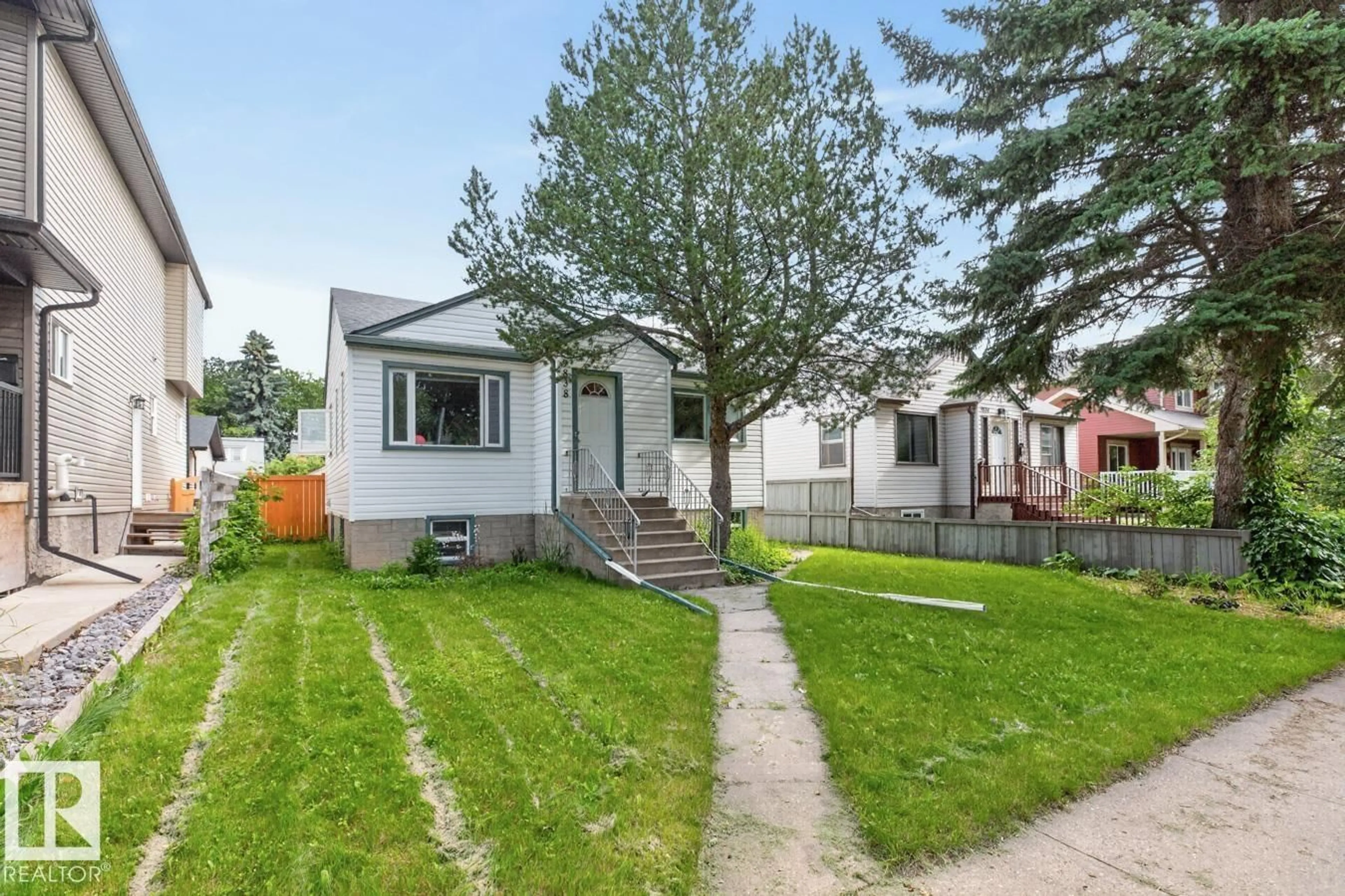 Home with vinyl exterior material, street for NW - 9838 80 AV, Edmonton Alberta T6E1T1