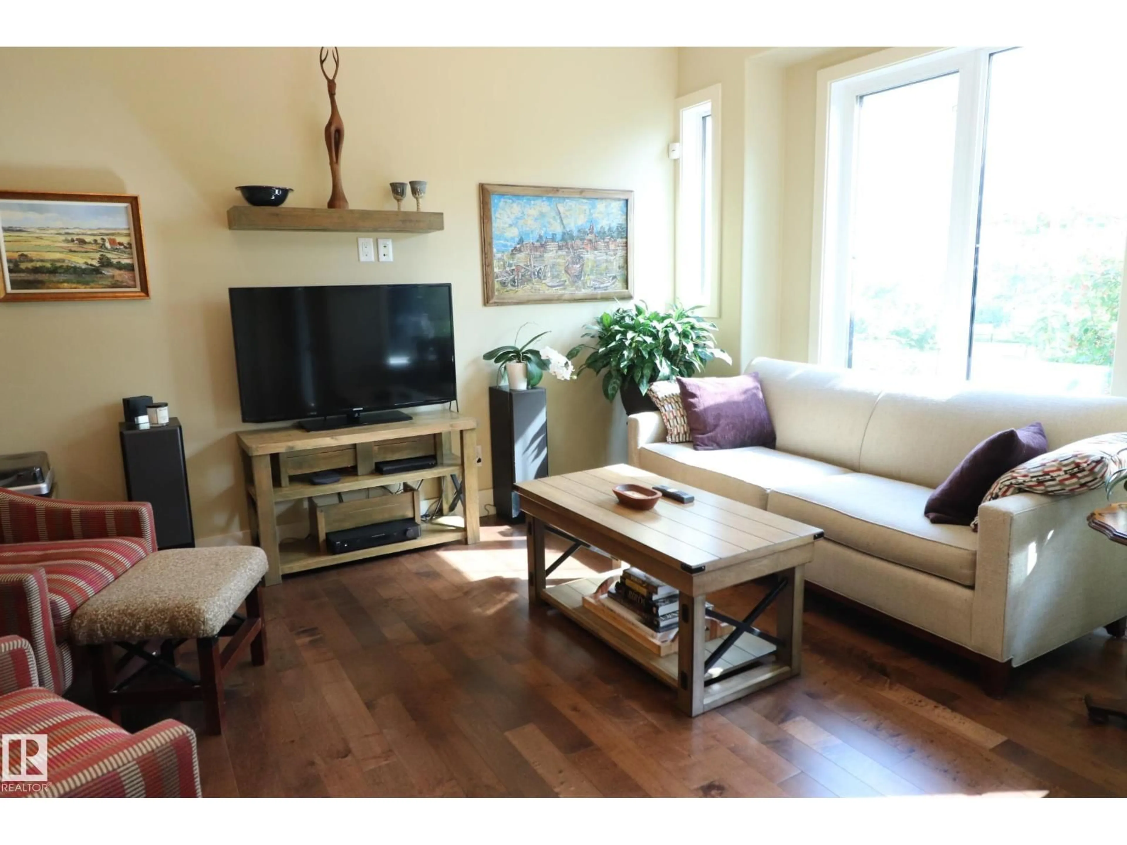 Living room with furniture, wood/laminate floor for NW - 7492 MAY CM, Edmonton Alberta T6R0G9