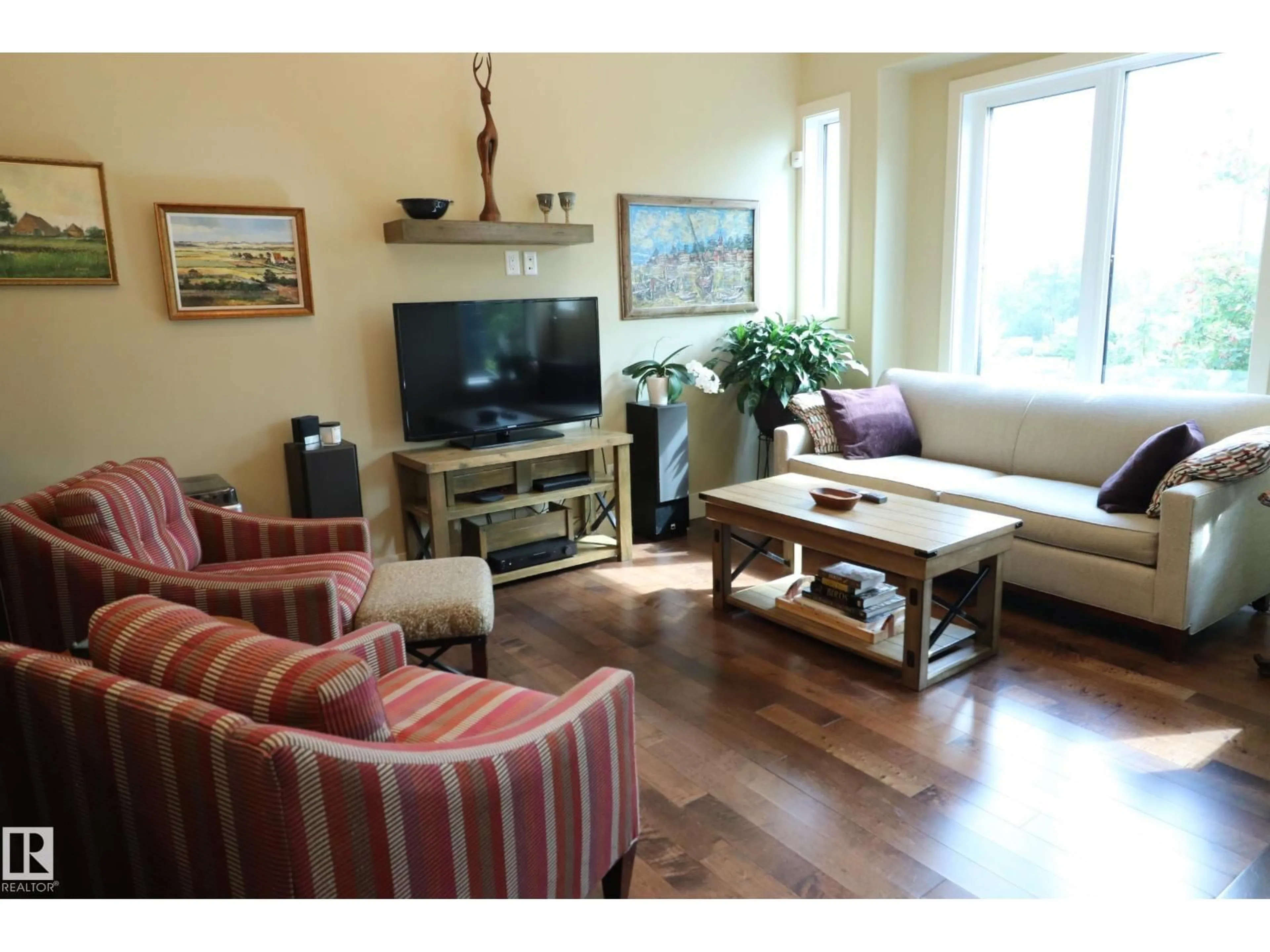 Living room with furniture, wood/laminate floor for NW - 7492 MAY CM, Edmonton Alberta T6R0G9