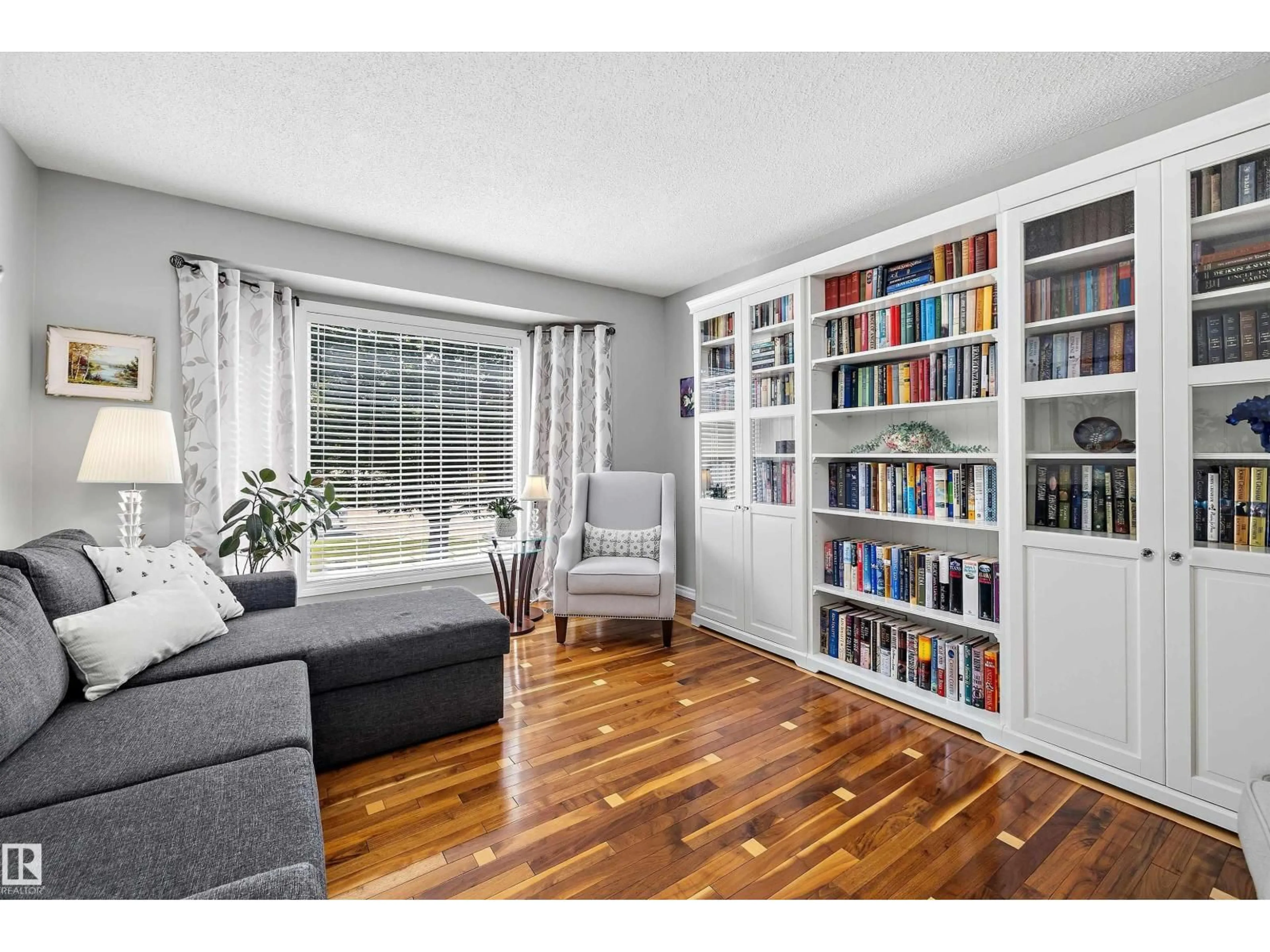 Living room with furniture, wood/laminate floor for 25 NOTTINGHAM CR, Sherwood Park Alberta T8A5H6