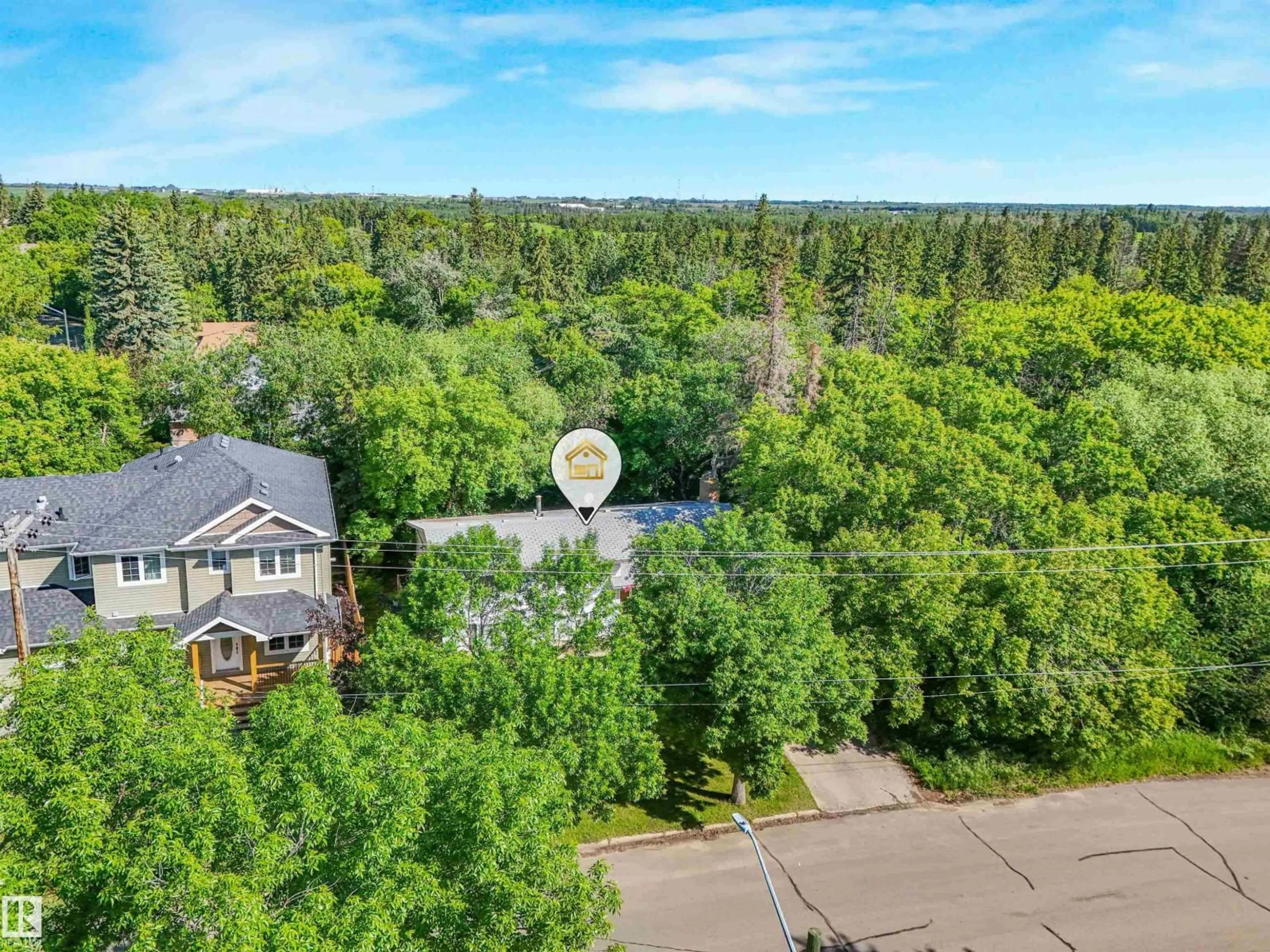 A pic from outside/outdoor area/front of a property/back of a property/a pic from drone, forest/trees view for 10904 100 AV, Fort Saskatchewan Alberta T8L2A4