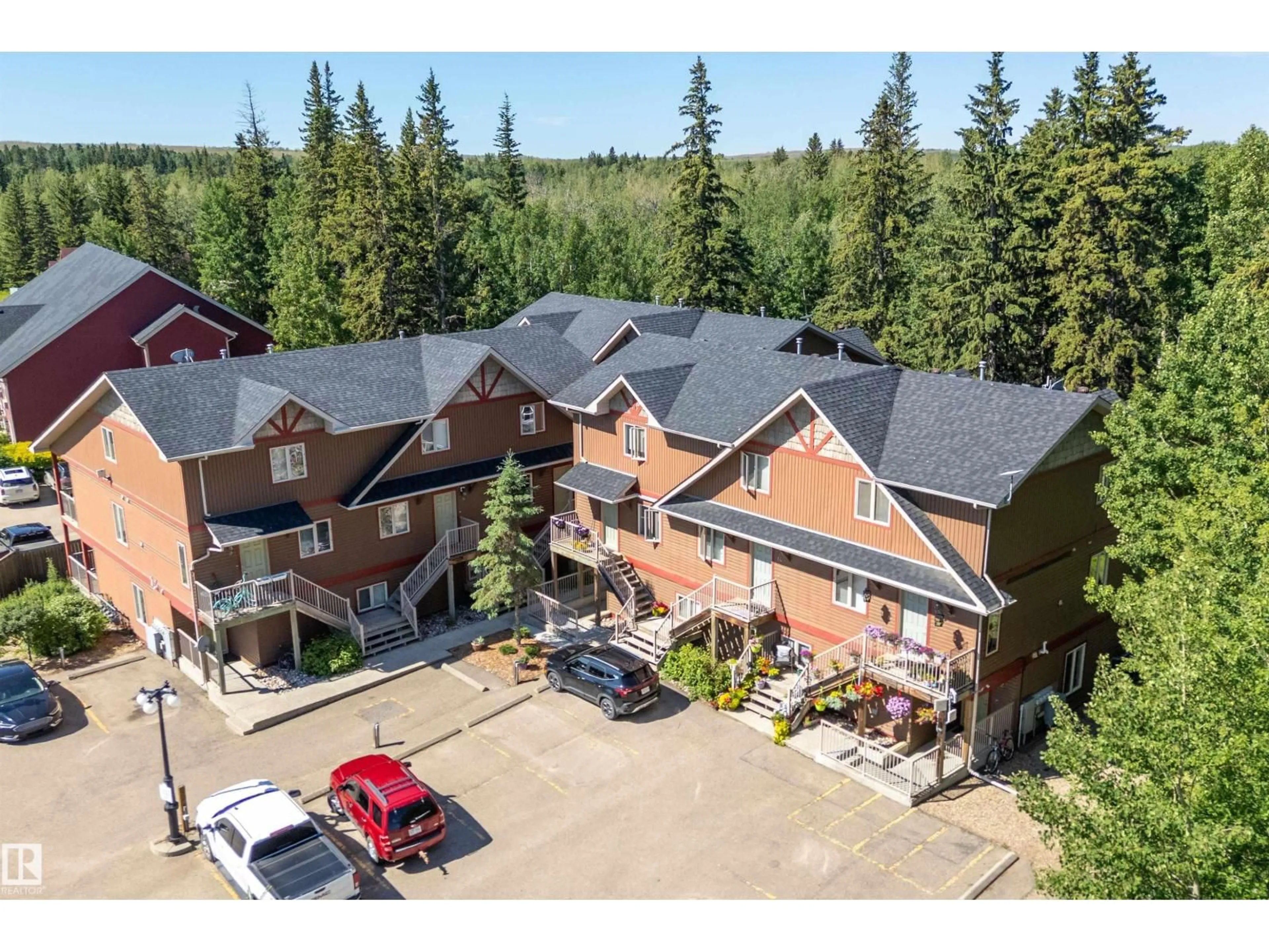 A pic from outside/outdoor area/front of a property/back of a property/a pic from drone, unknown for 5 - 100 HERON POINT CL, Rural Wetaskiwin County Alberta T0C2V0