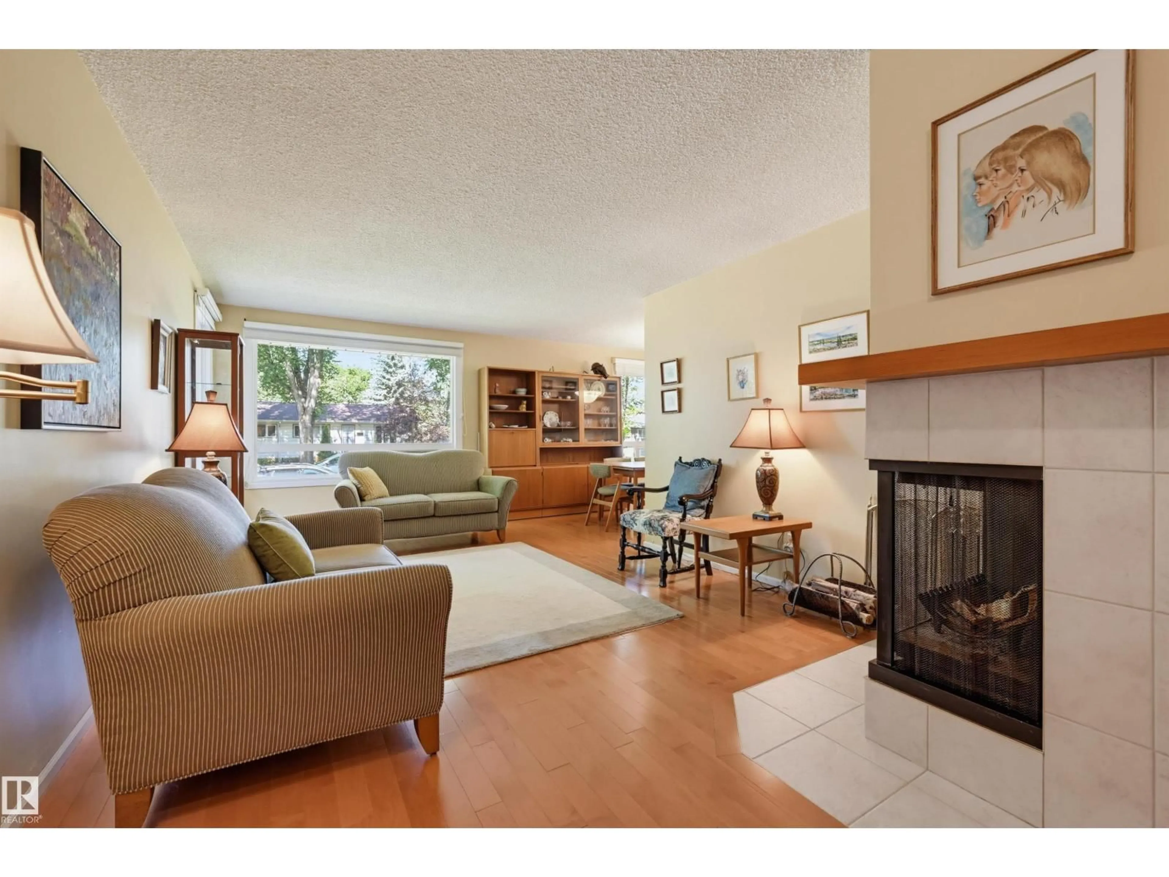 Living room with furniture, wood/laminate floor for NW - 9247 148 ST, Edmonton Alberta T5R1A4