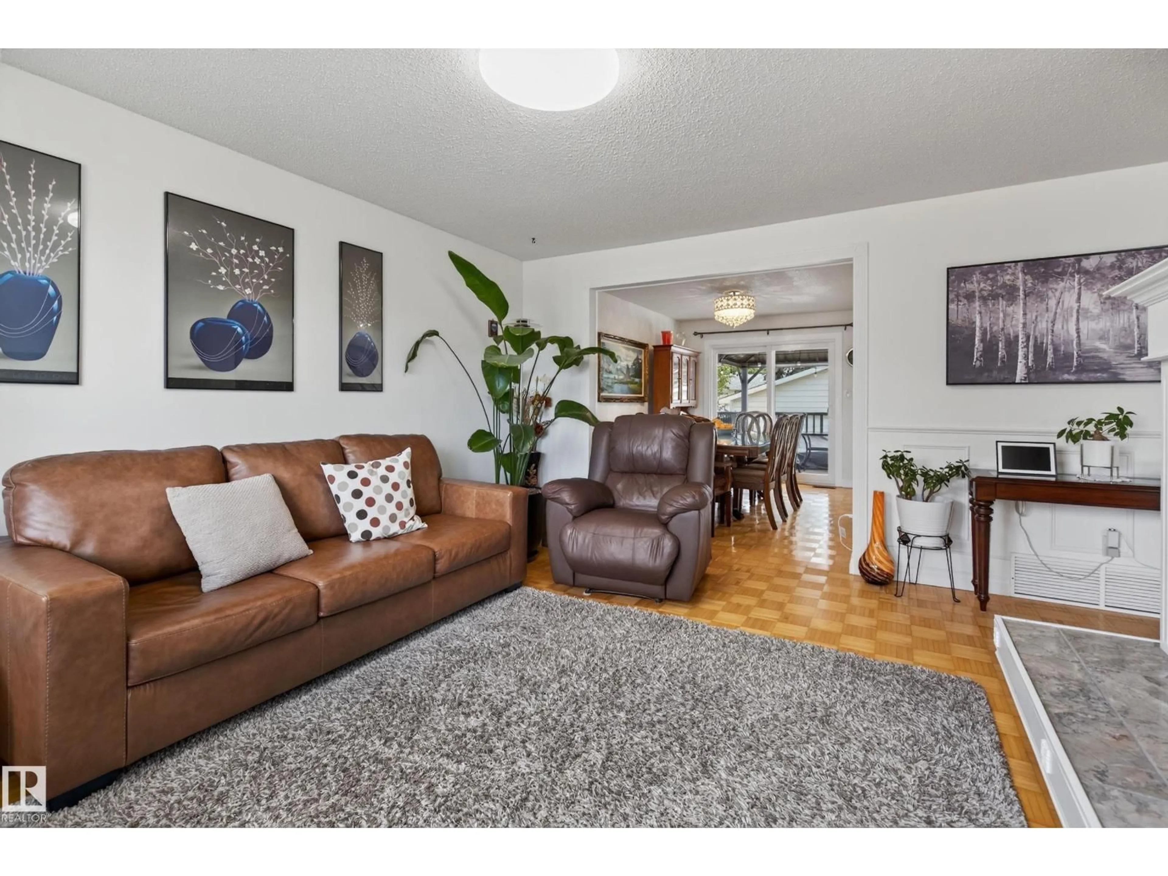 Living room with furniture, wood/laminate floor for 18509 92A AV, Edmonton Alberta T5T1P5