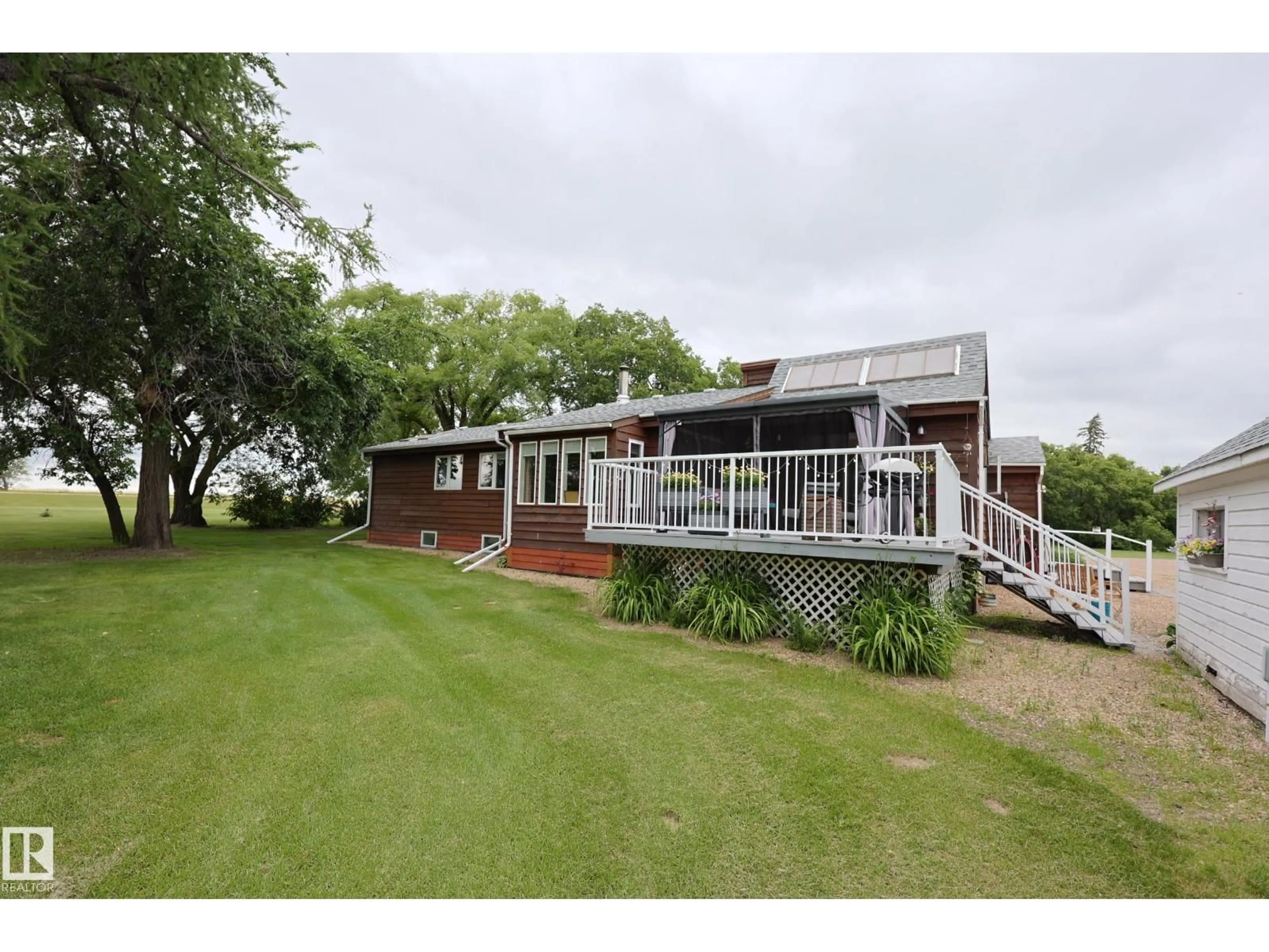 A pic from outside/outdoor area/front of a property/back of a property/a pic from drone, water/lake/river/ocean view for 59503 HWY 2, Rural Westlock County Alberta T0G0P0