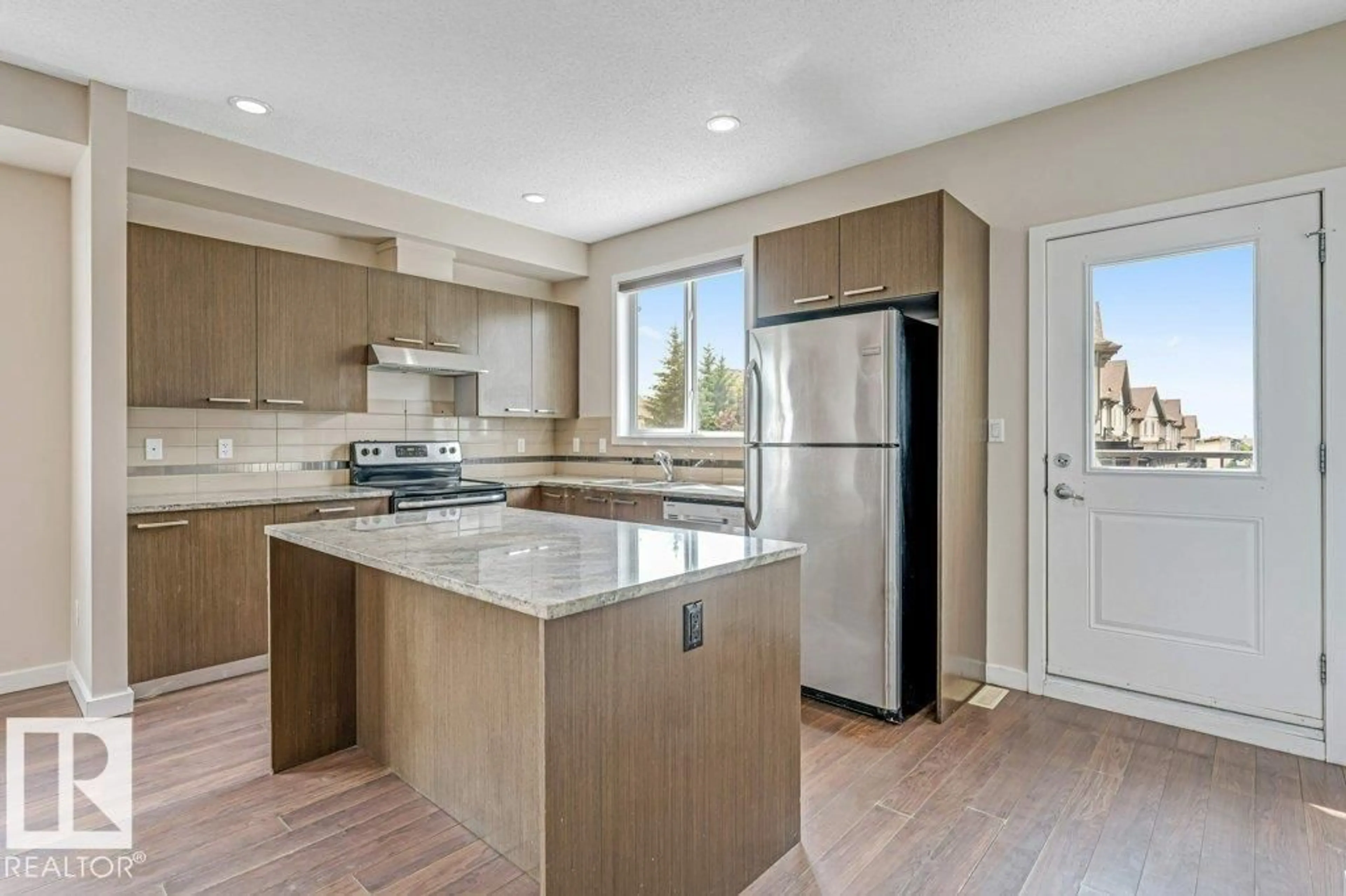 Open concept kitchen, unknown for 655 WATT BV, Edmonton Alberta T6X0Y2