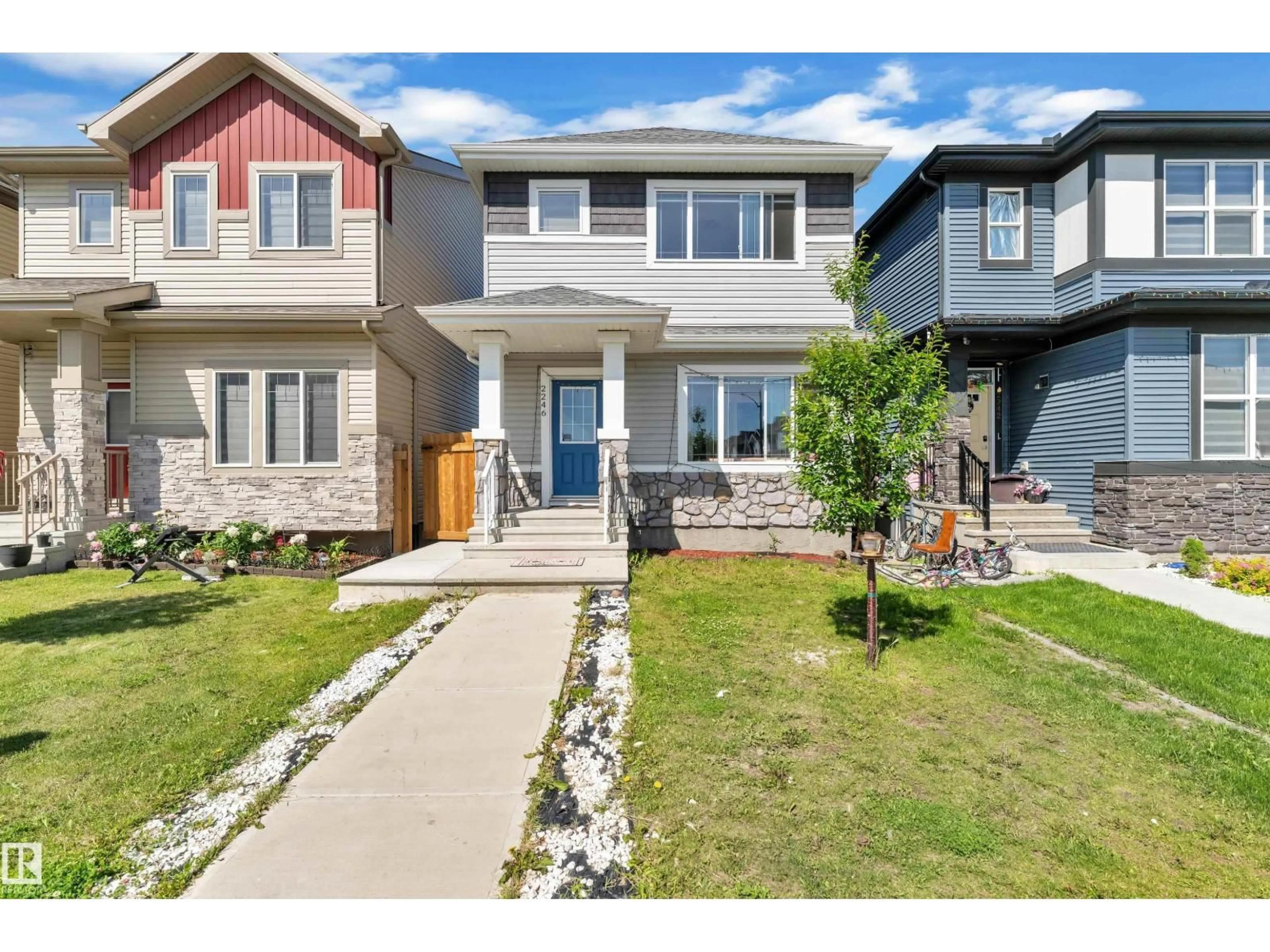 Home with vinyl exterior material, street for SW - 2246 54 ST, Edmonton Alberta T6X2X7