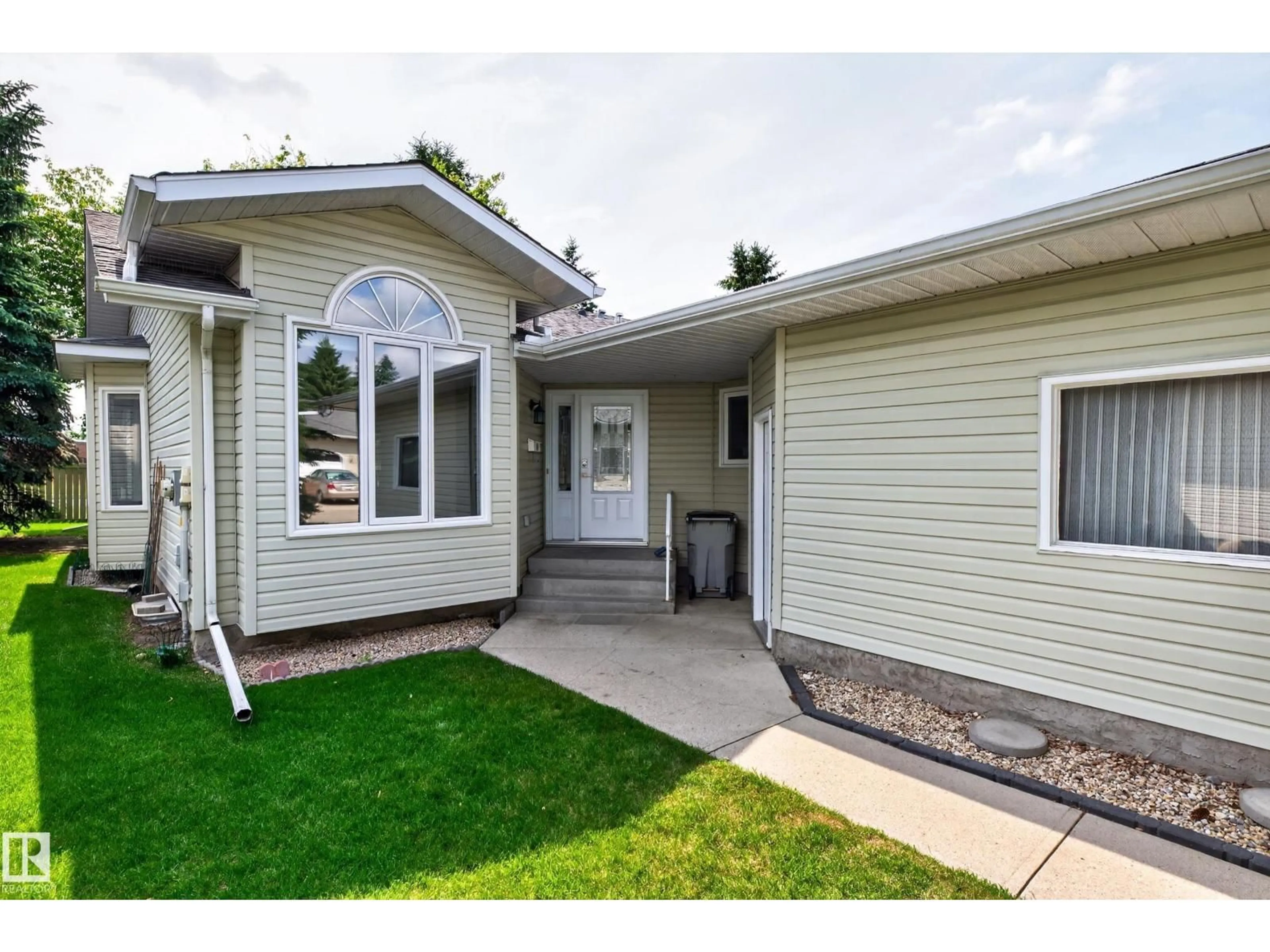 Home with vinyl exterior material, street for 117 ALTON DR, Leduc Alberta T9E6N3