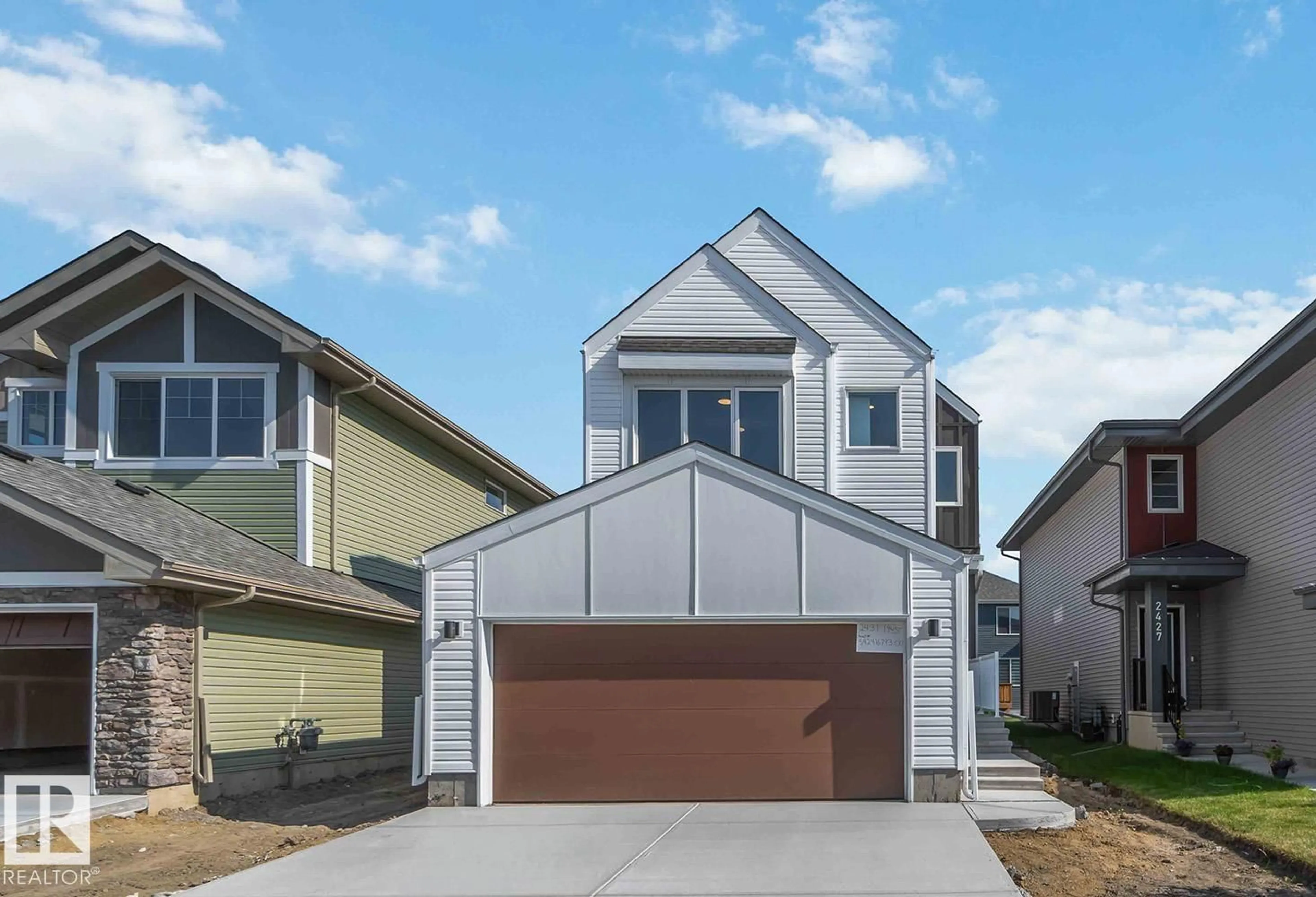 Home with vinyl exterior material, street for 2431 194 ST, Edmonton Alberta T6M1P5