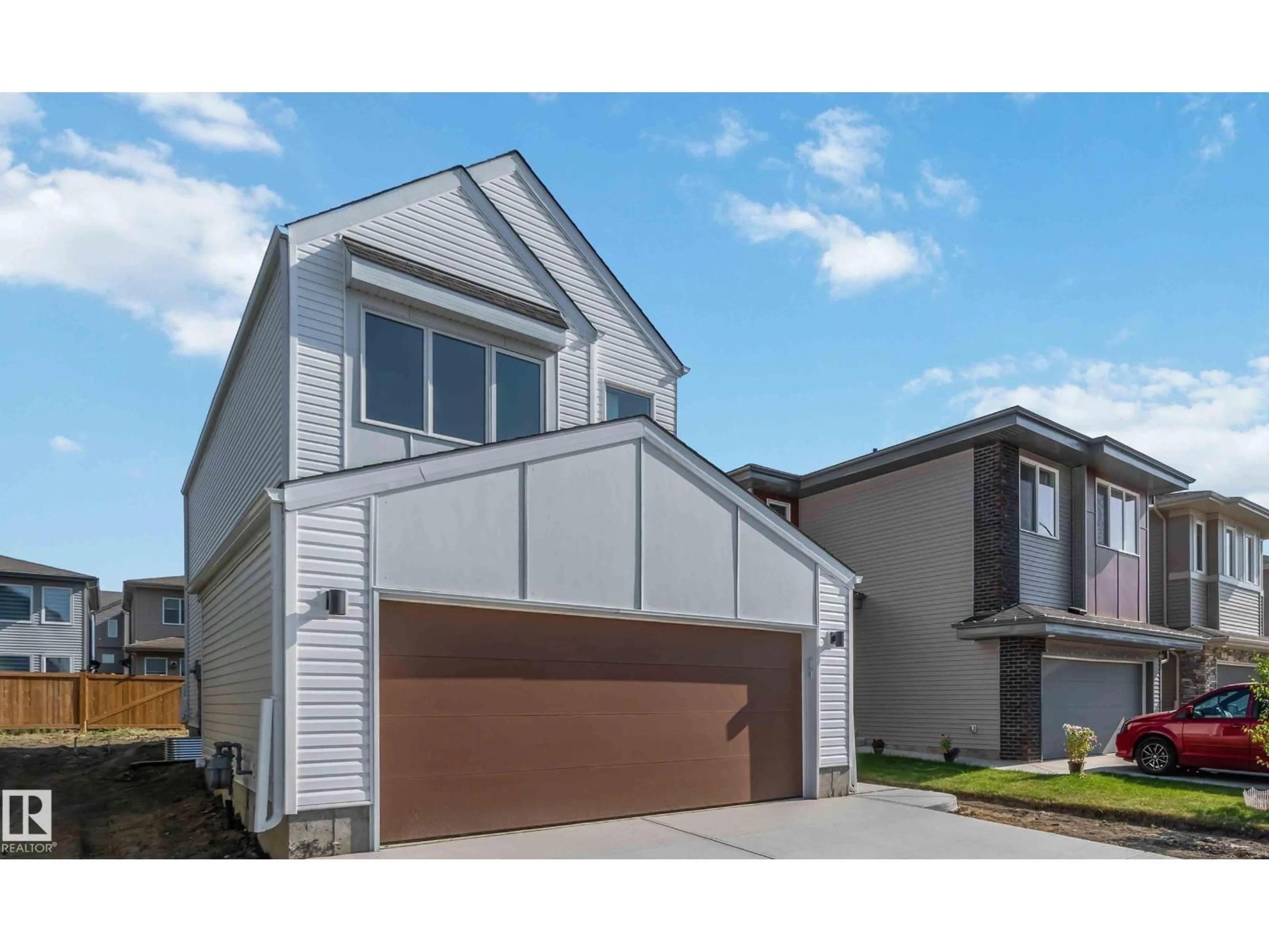 Home with vinyl exterior material, street for 2431 194 ST, Edmonton Alberta T6M1P5