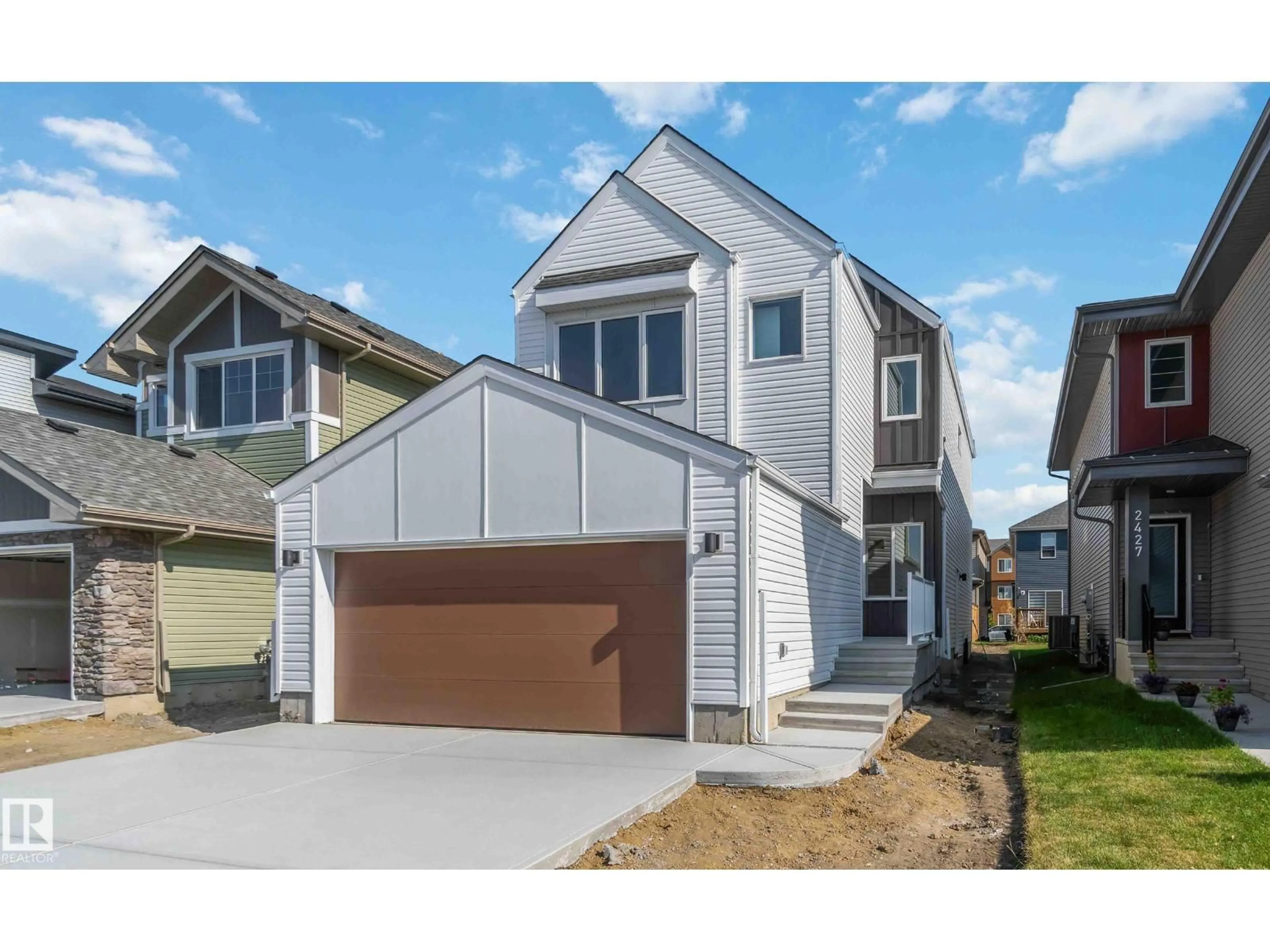Home with vinyl exterior material, street for 2431 194 ST, Edmonton Alberta T6M1P5