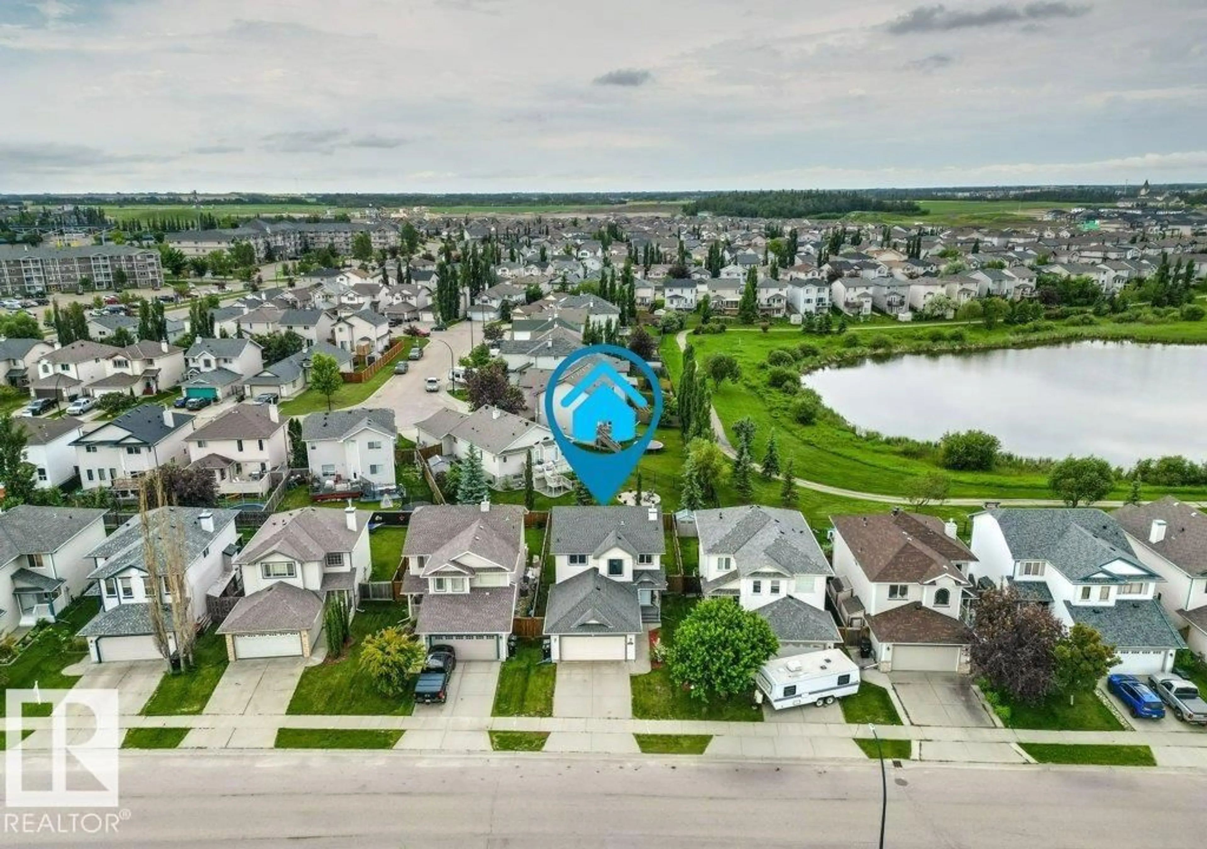 A pic from outside/outdoor area/front of a property/back of a property/a pic from drone, water/lake/river/ocean view for 27 SPRUCE RIDGE DR, Spruce Grove Alberta T7X4M8