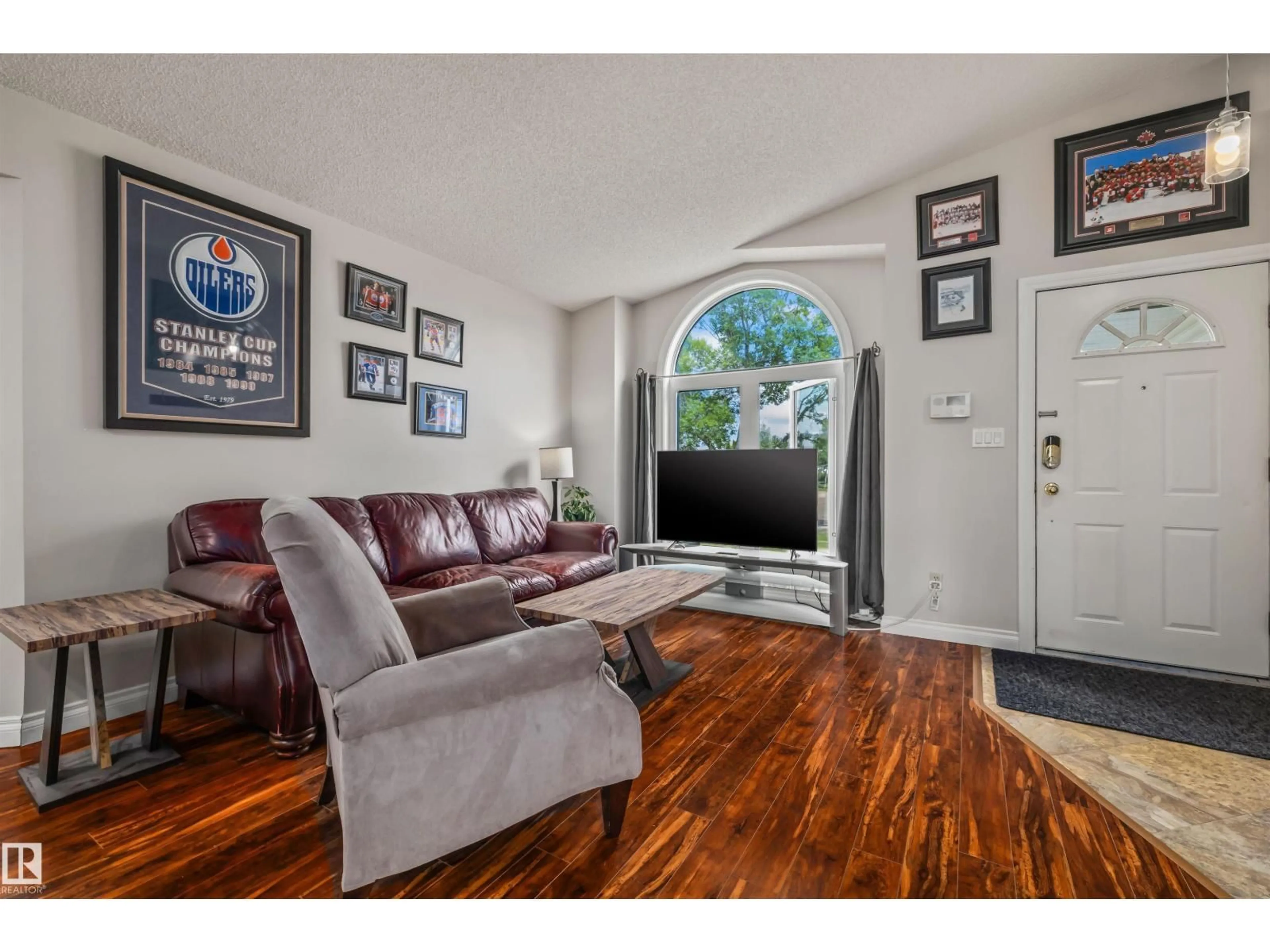 Living room with furniture, wood/laminate floor for 26 WESTPARK WY, Fort Saskatchewan Alberta T8L3W8