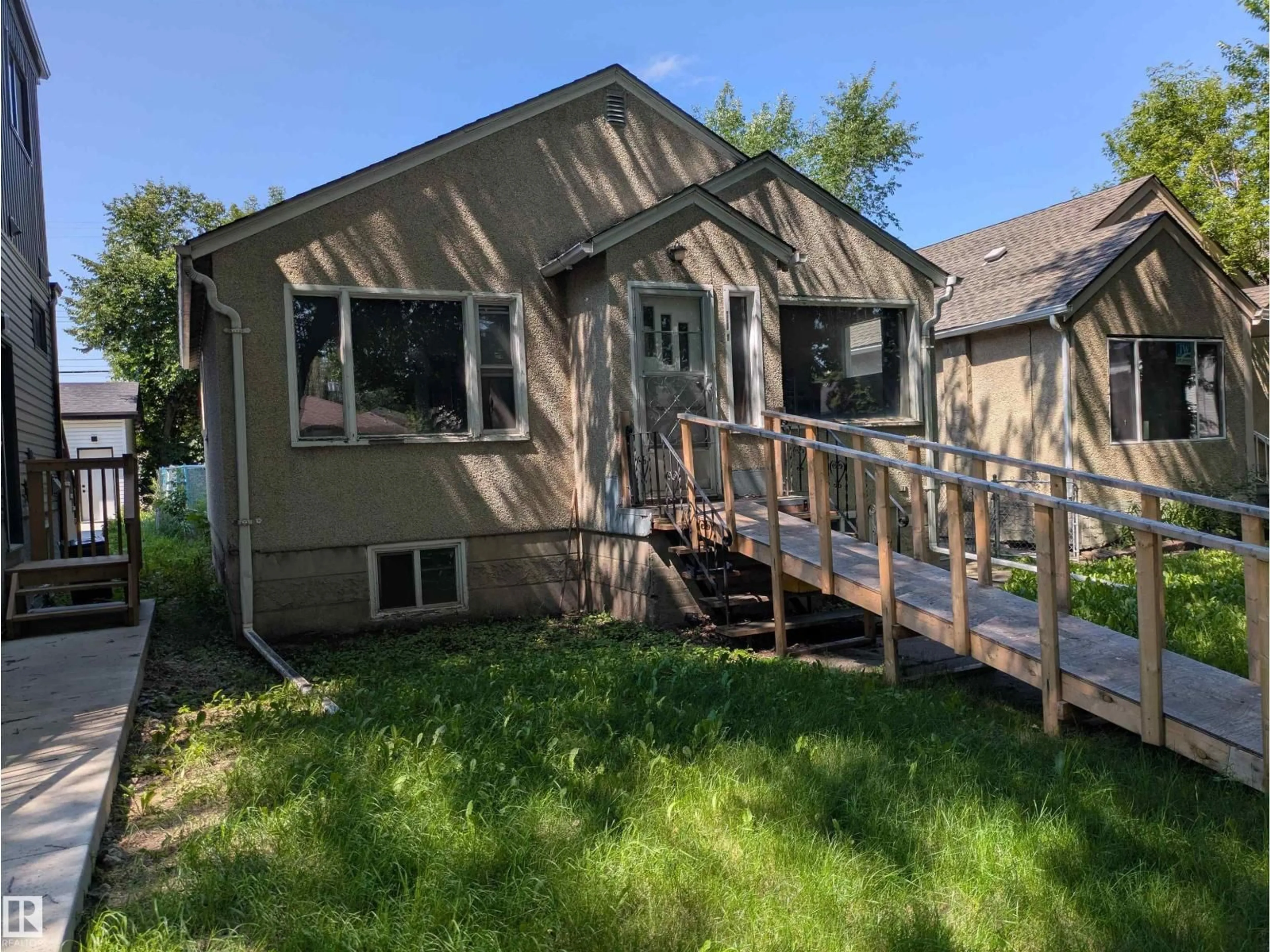 Home with vinyl exterior material, street for NW - 11412 85 ST, Edmonton Alberta T5B3C9