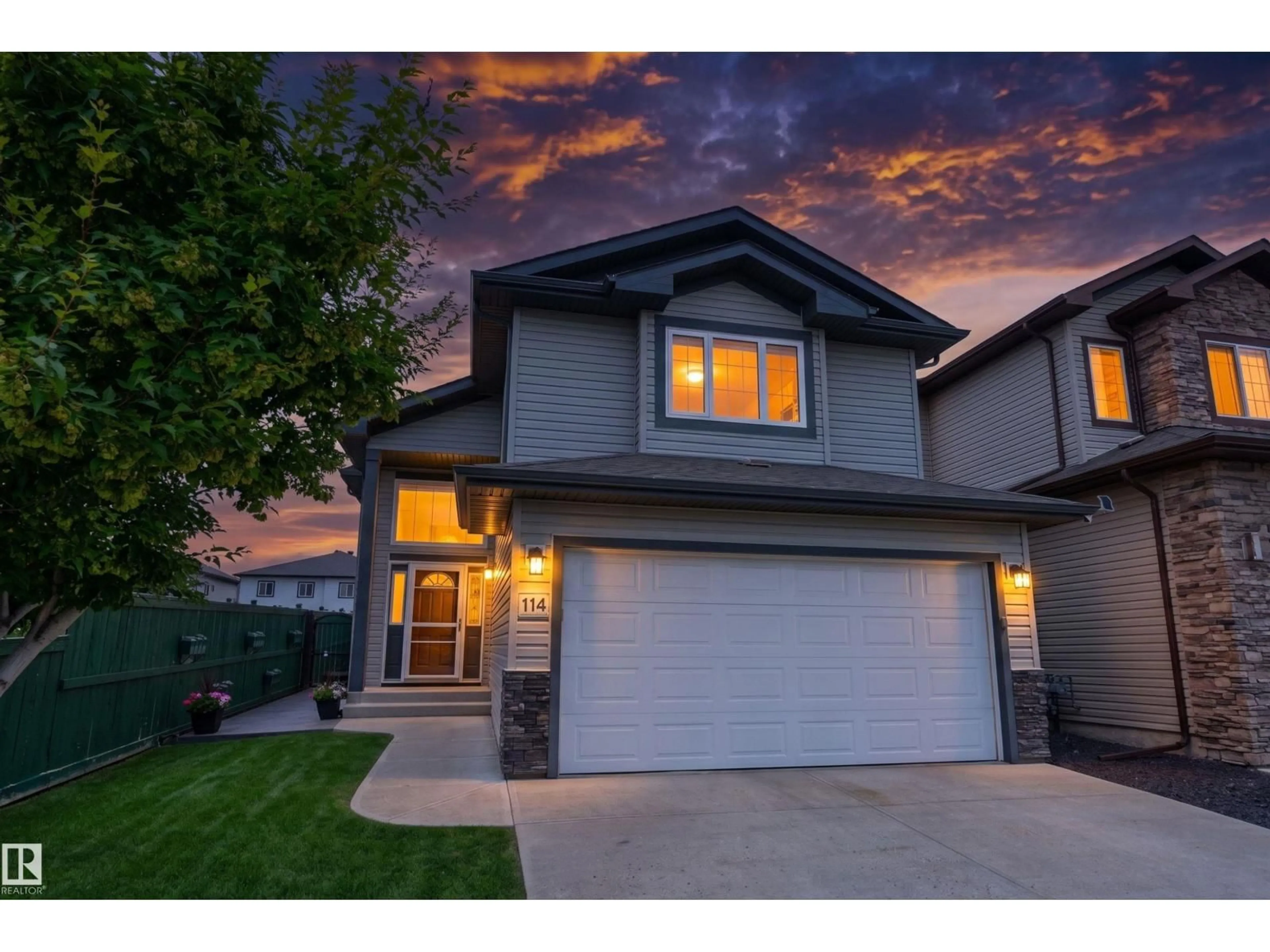 Home with vinyl exterior material, street for 114 WOODHILL LN, Fort Saskatchewan Alberta T8L0L8