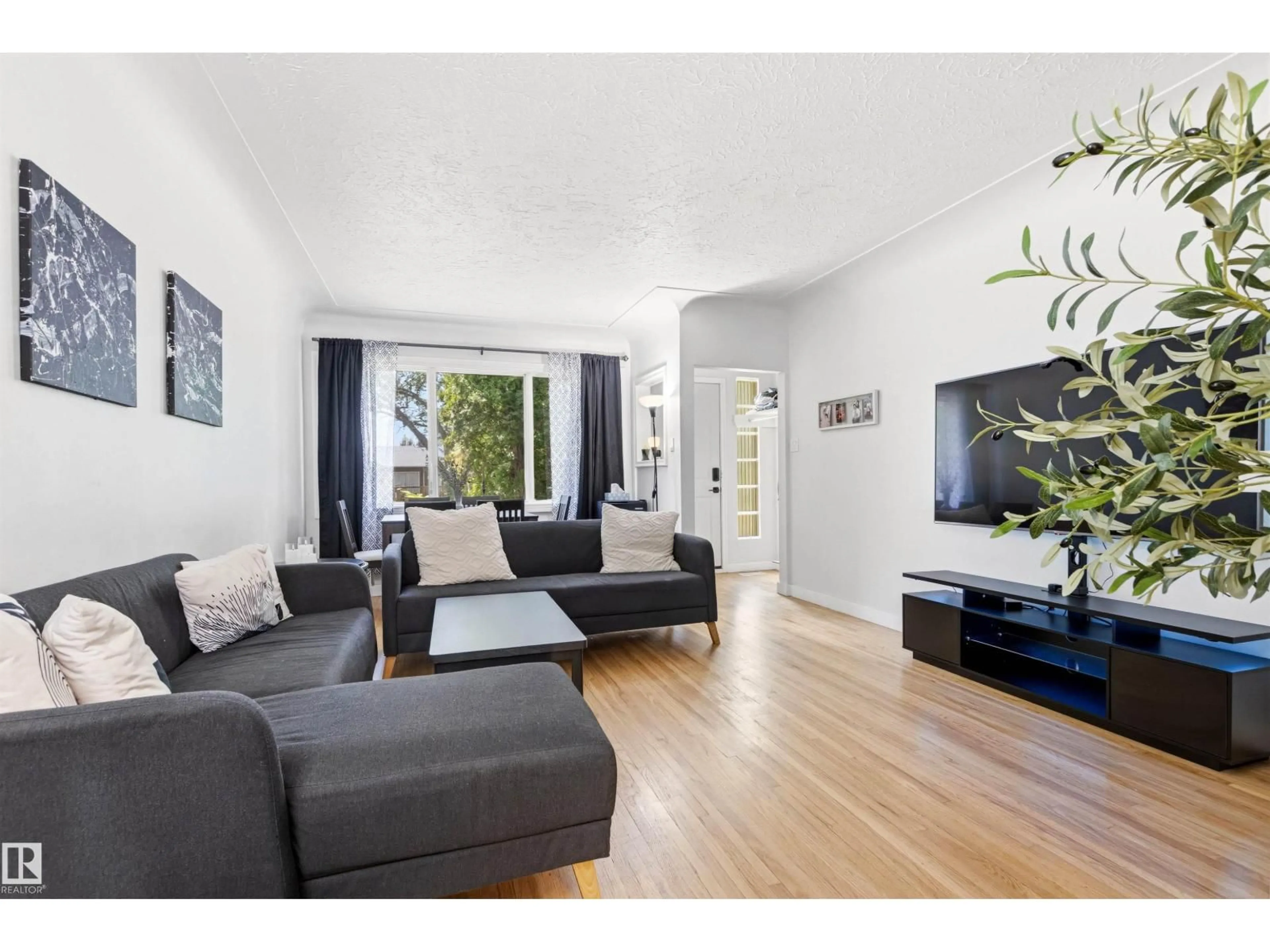 Living room with furniture, unknown for NW - 11115 116 ST, Edmonton Alberta T5G2V7