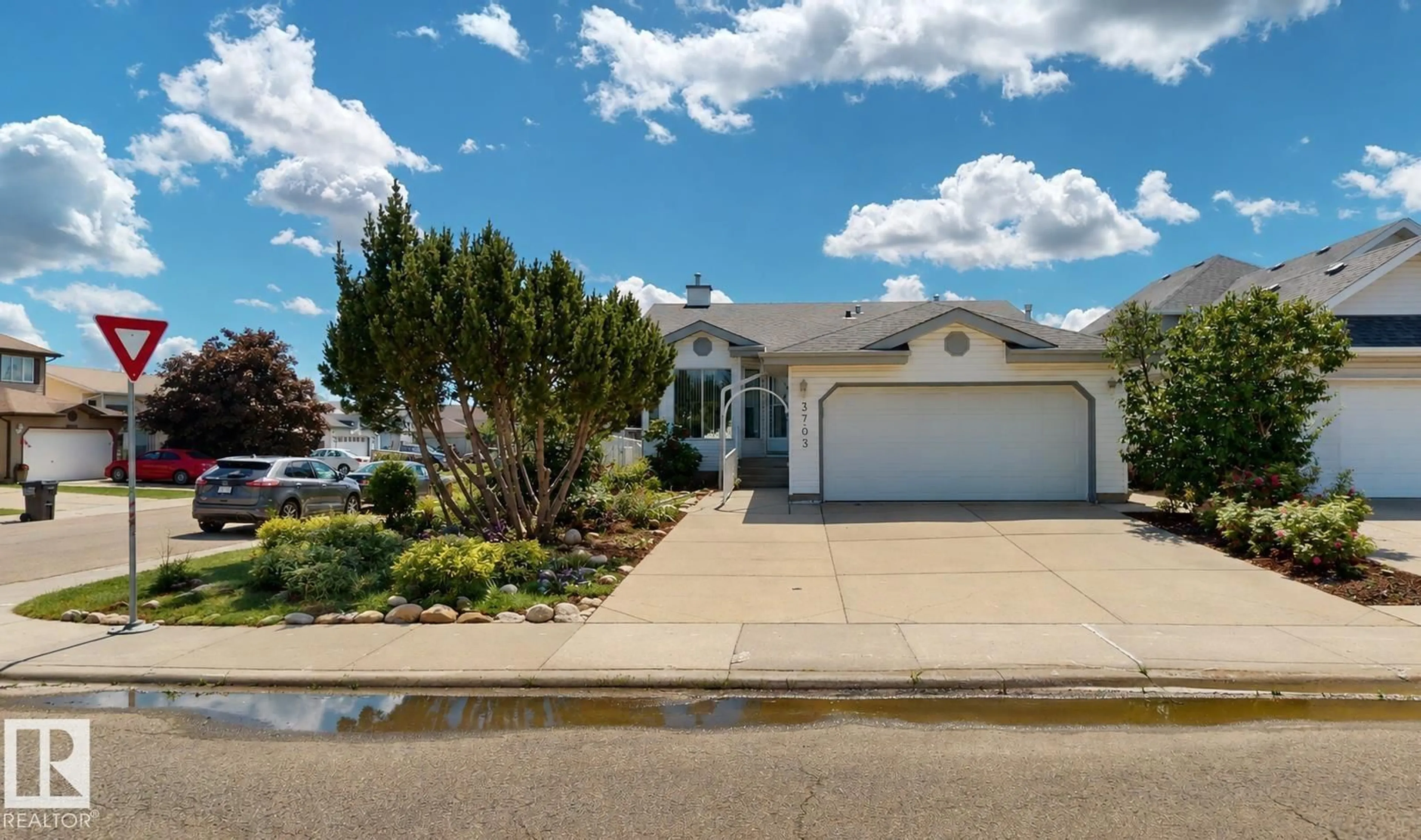 Home with vinyl exterior material, street for 3703 131 AV, Edmonton Alberta T5A5A4