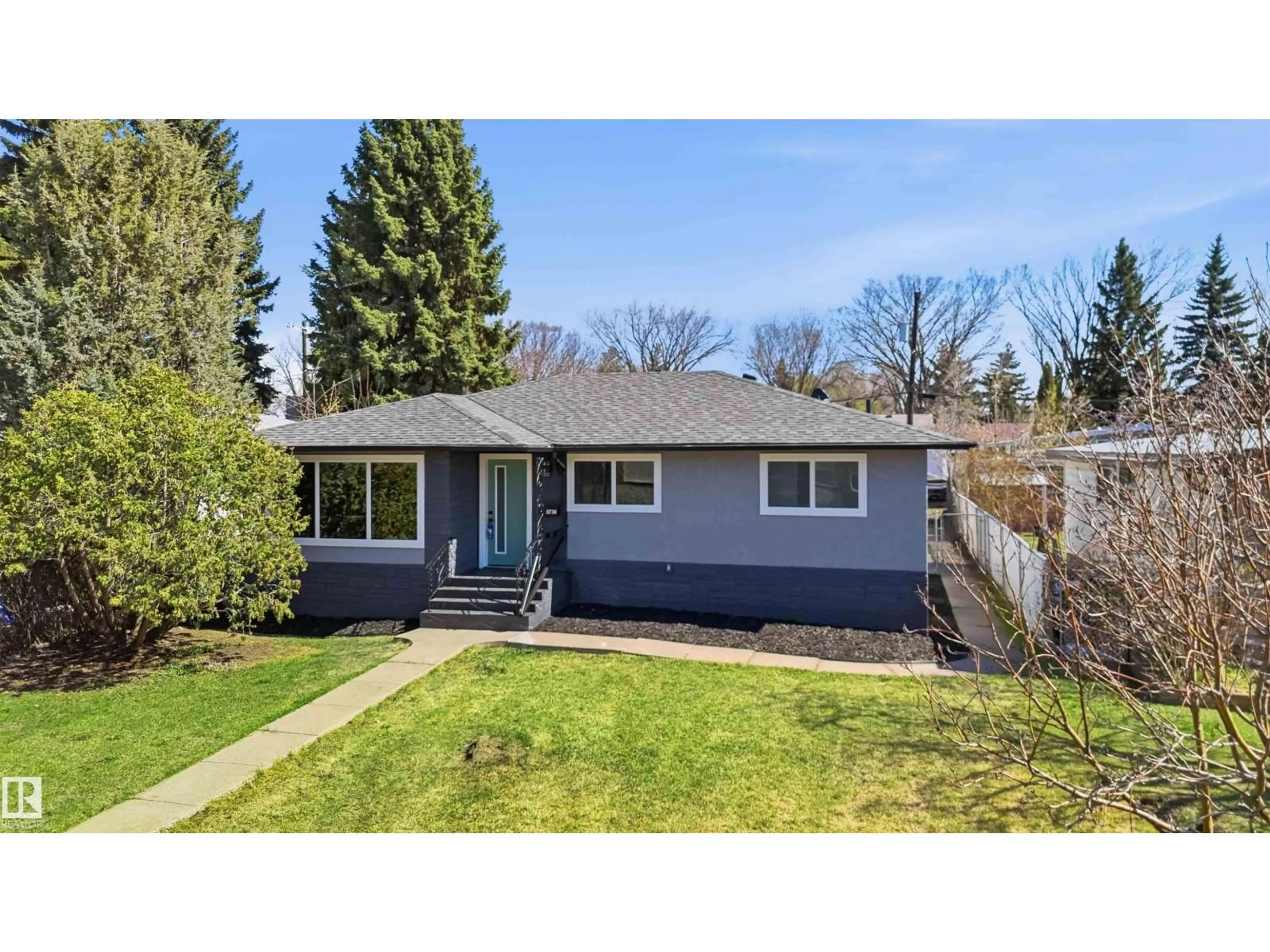 Home with vinyl exterior material, street for 8736 66 AV, Edmonton Alberta T6E0L3