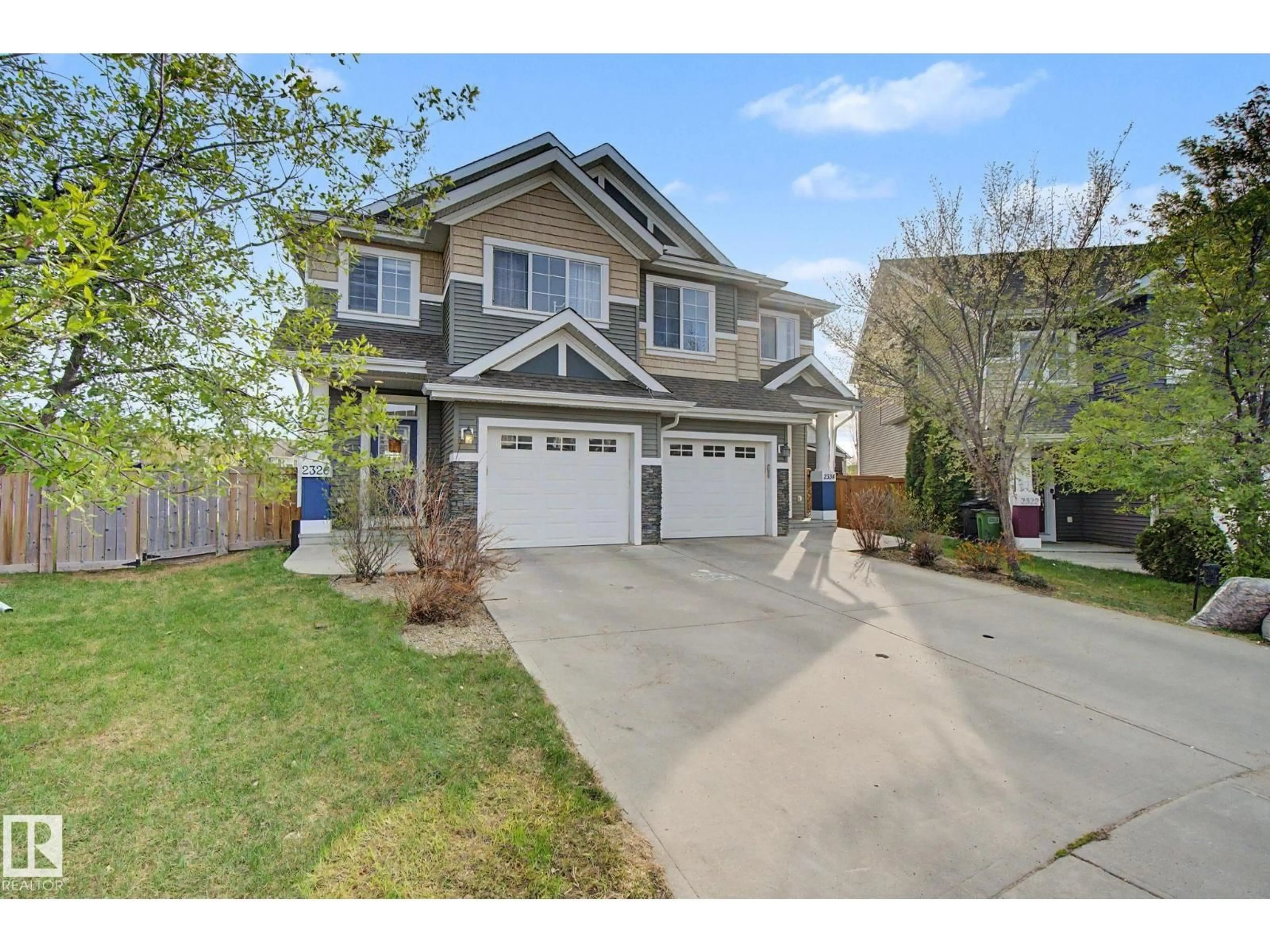 Home with vinyl exterior material, street for 2326 74 ST, Edmonton Alberta T6X0V5