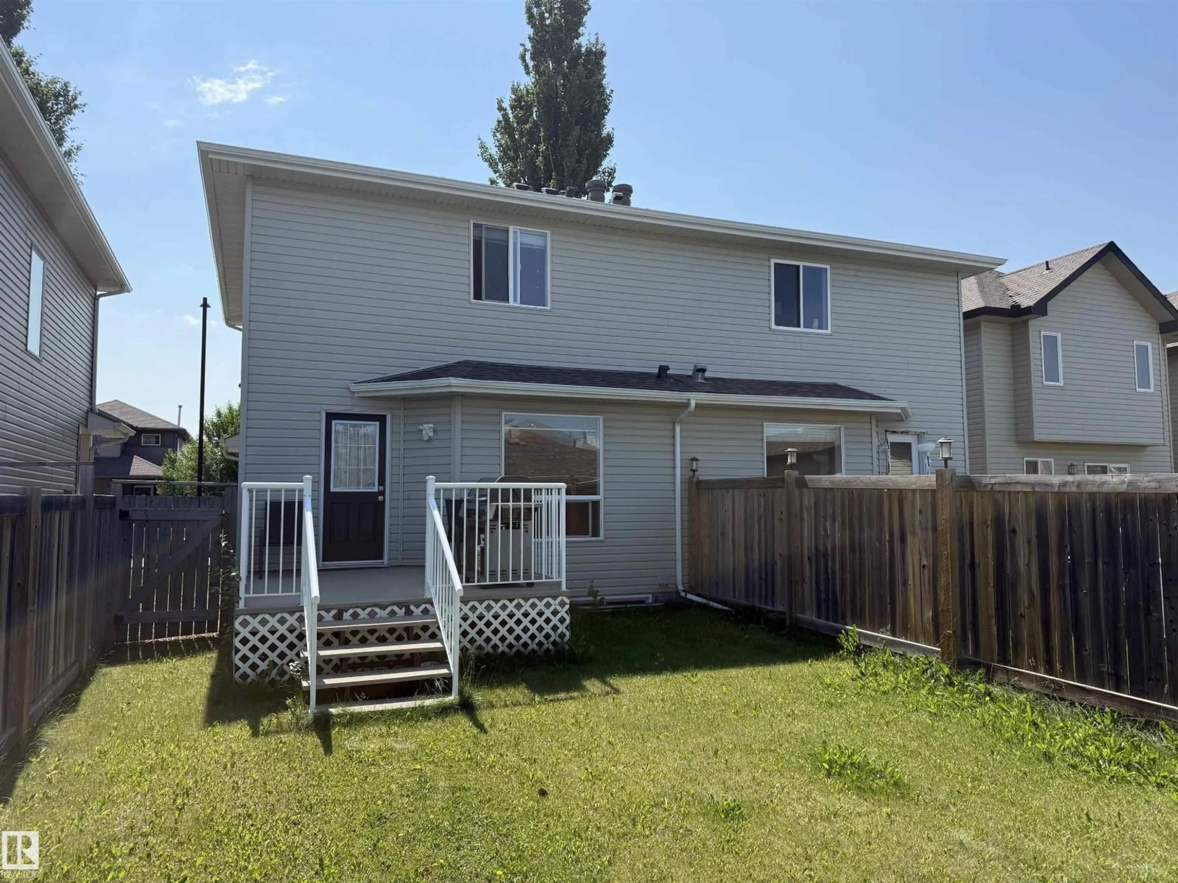 Home with vinyl exterior material, street for 2314 29A AV, Edmonton Alberta T6T2B2