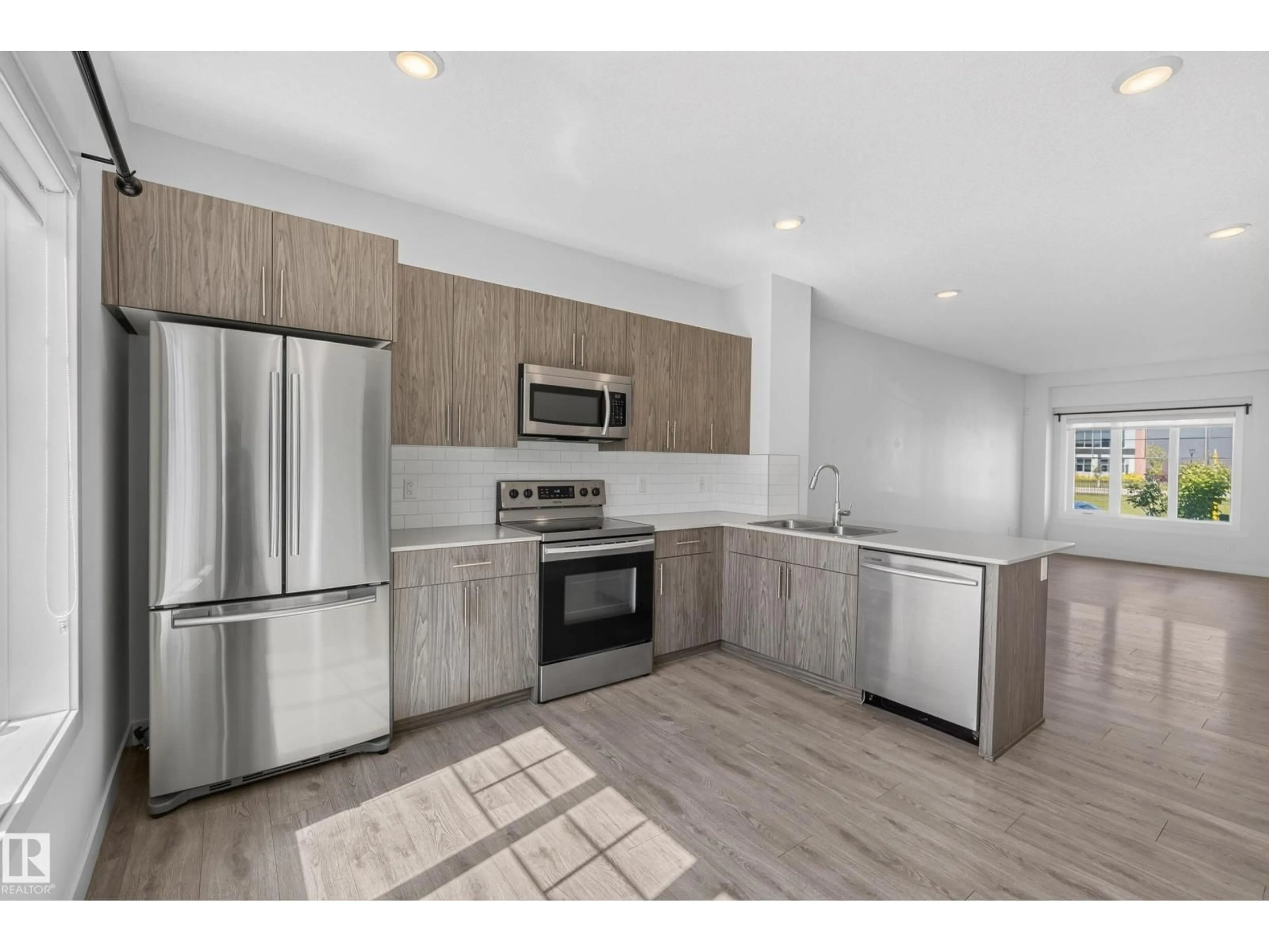 Open concept kitchen, unknown for 2707 ORCHARDS RD, Edmonton Alberta T6X2M9