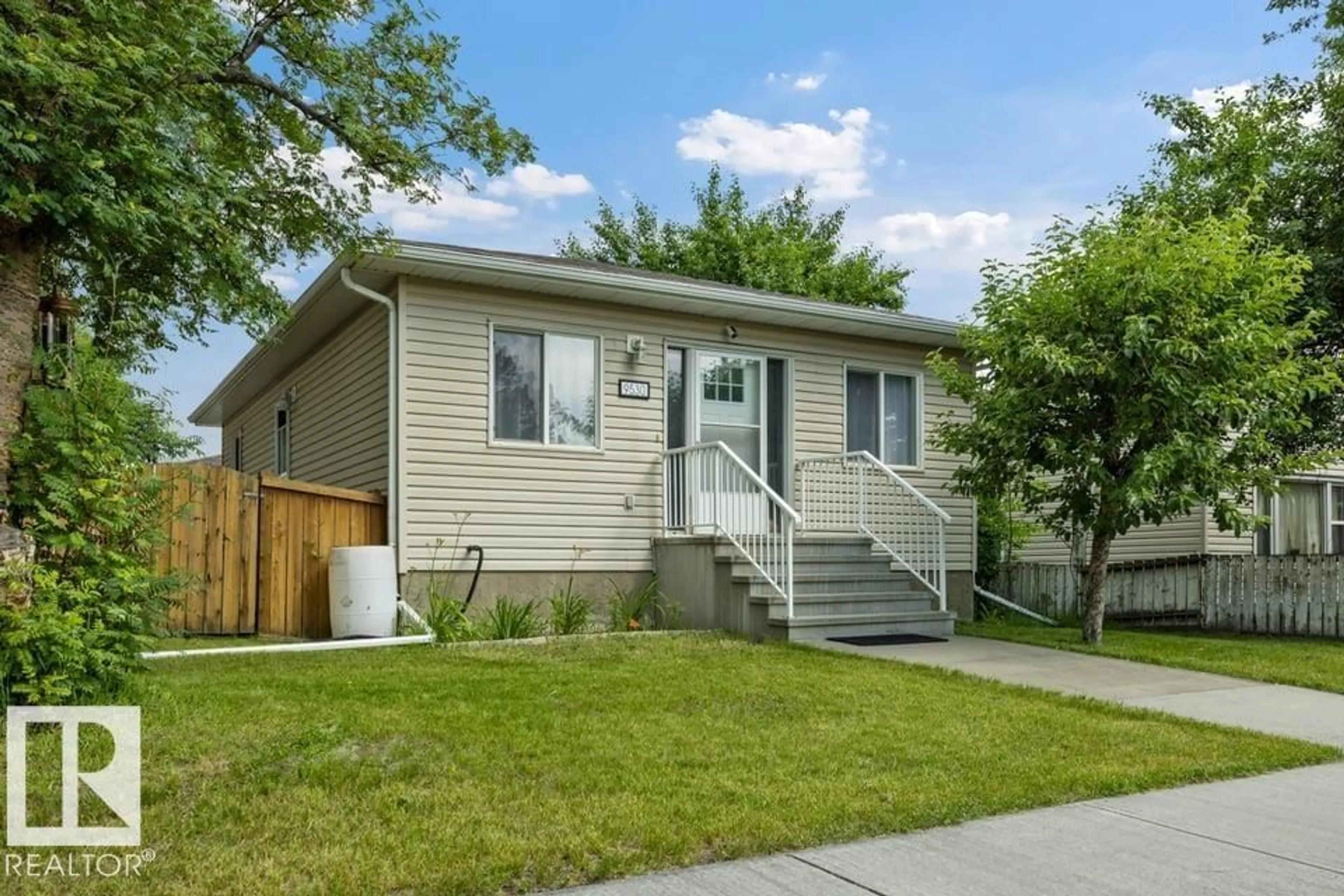 Home with vinyl exterior material, street for 9530 122 AV, Edmonton Alberta T5G0T6