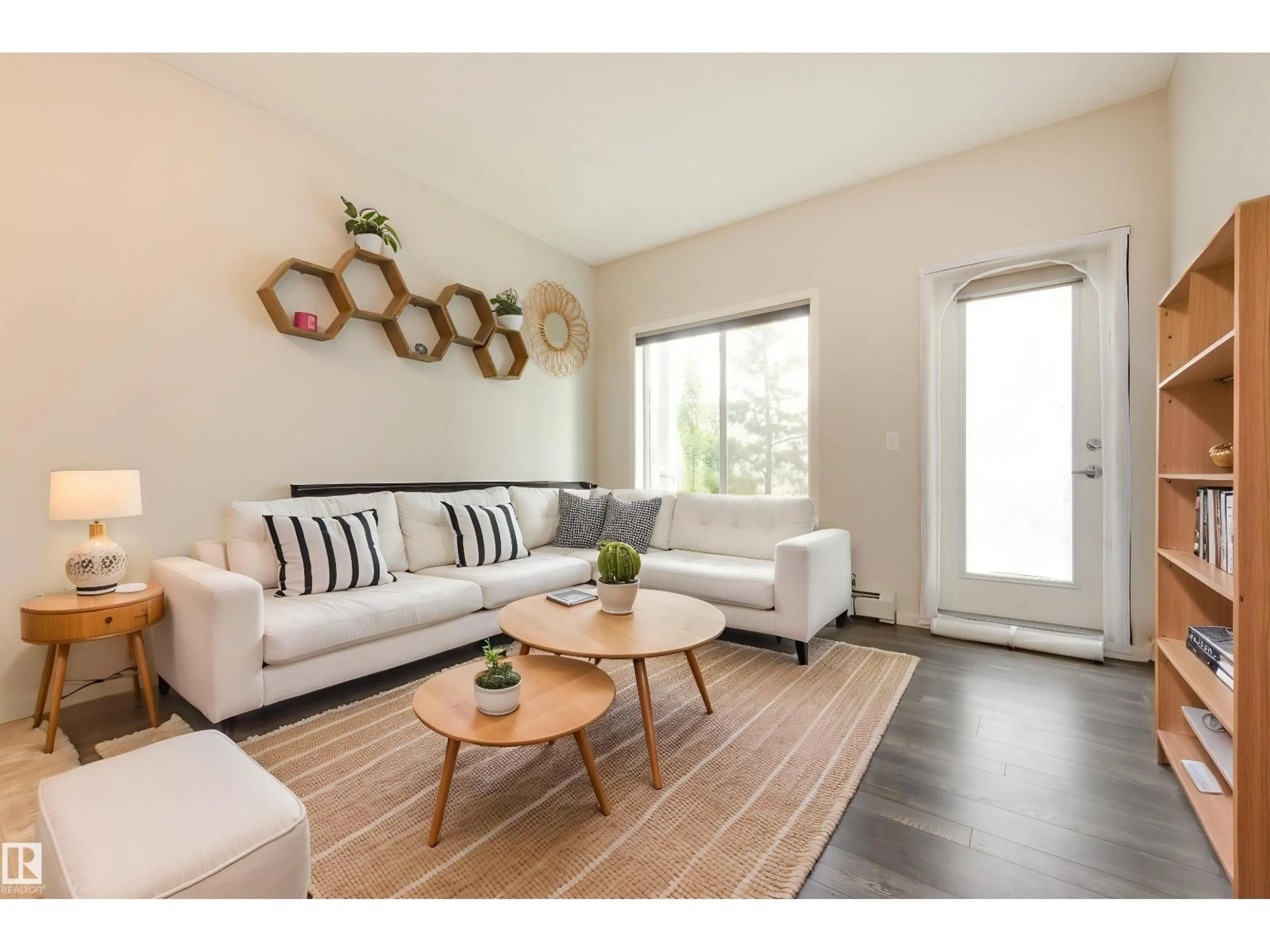 Living room with furniture, wood/laminate floor for 1820 - 120 RUTHERFORD RD SW, Edmonton Alberta T6W2K6