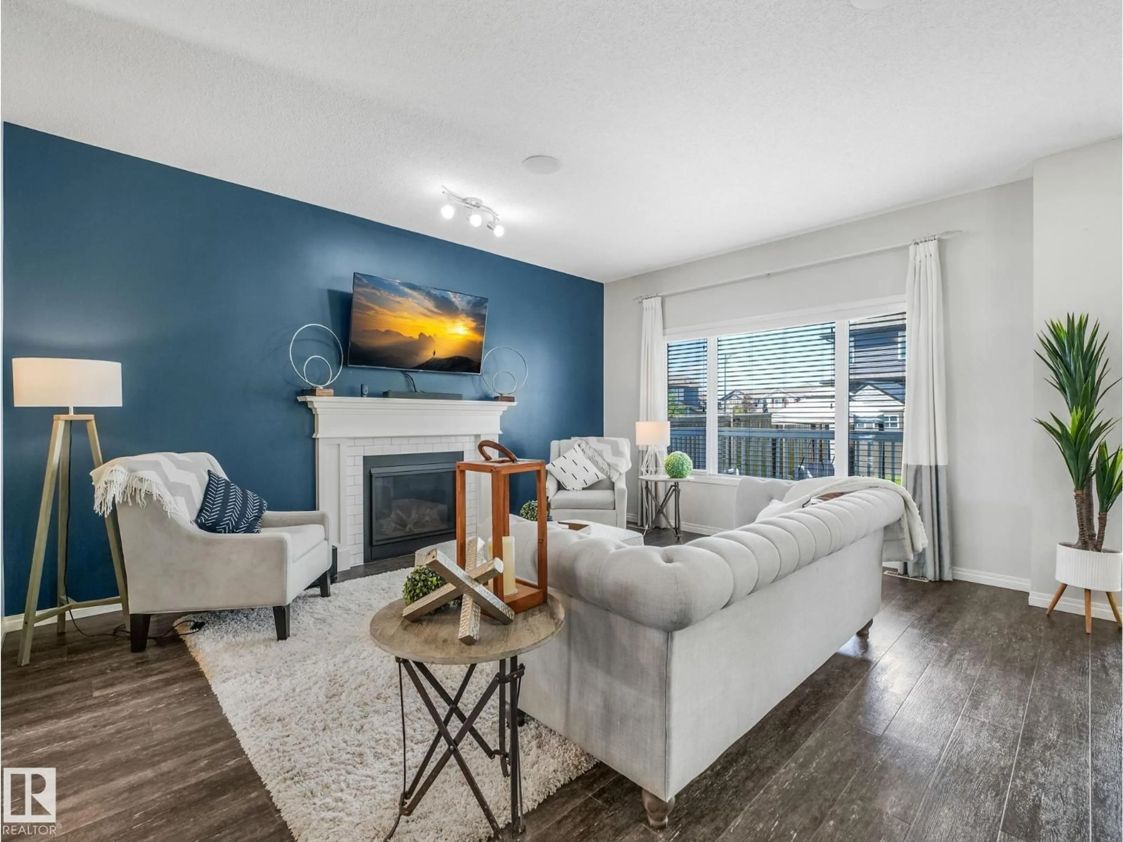 Living room with furniture, wood/laminate floor for 14 SUMAC LN, Sherwood Park Alberta T8H0Z5
