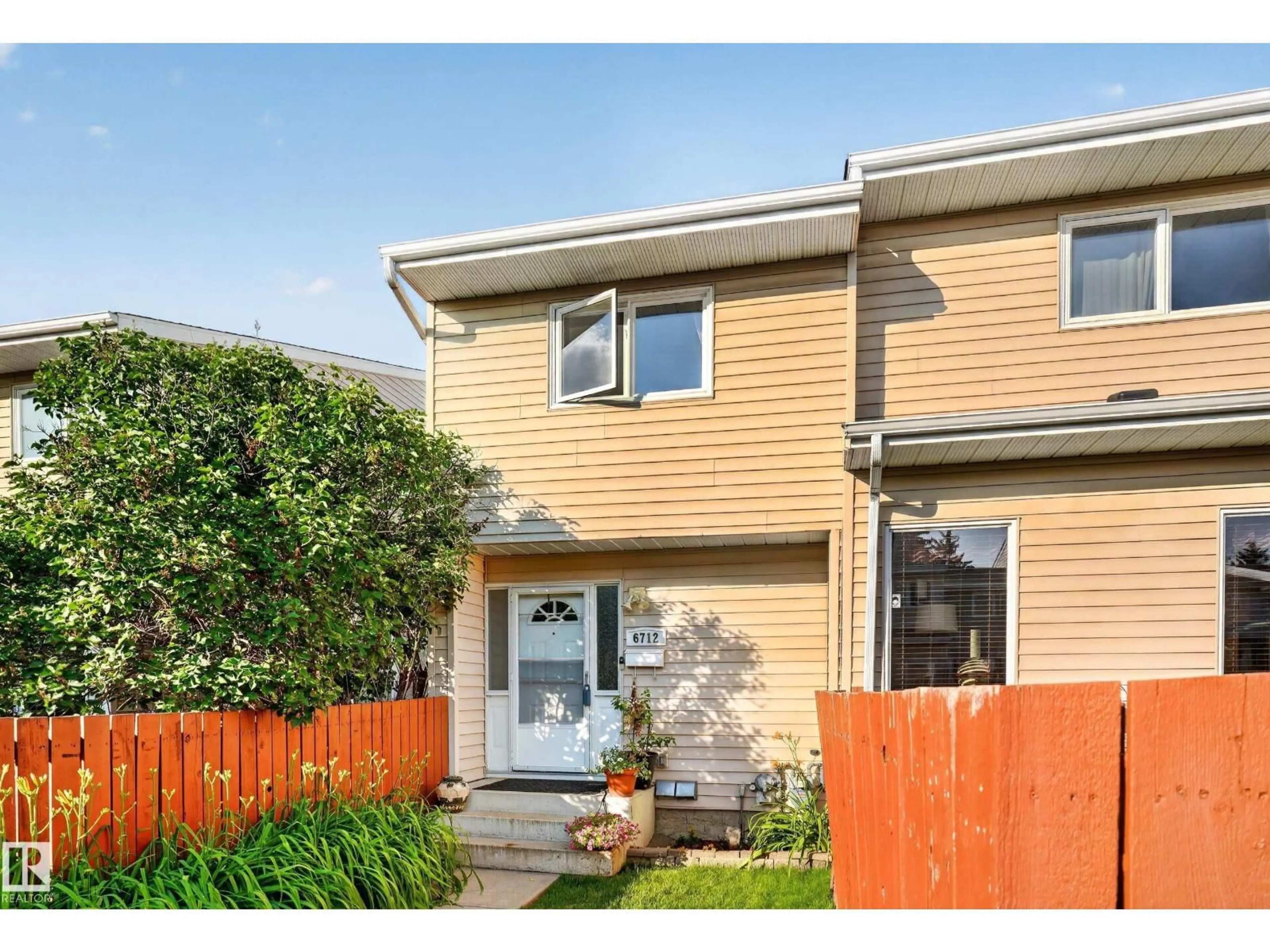 Home with vinyl exterior material, street for NW - 6712 36A AV, Edmonton Alberta T6K1S3