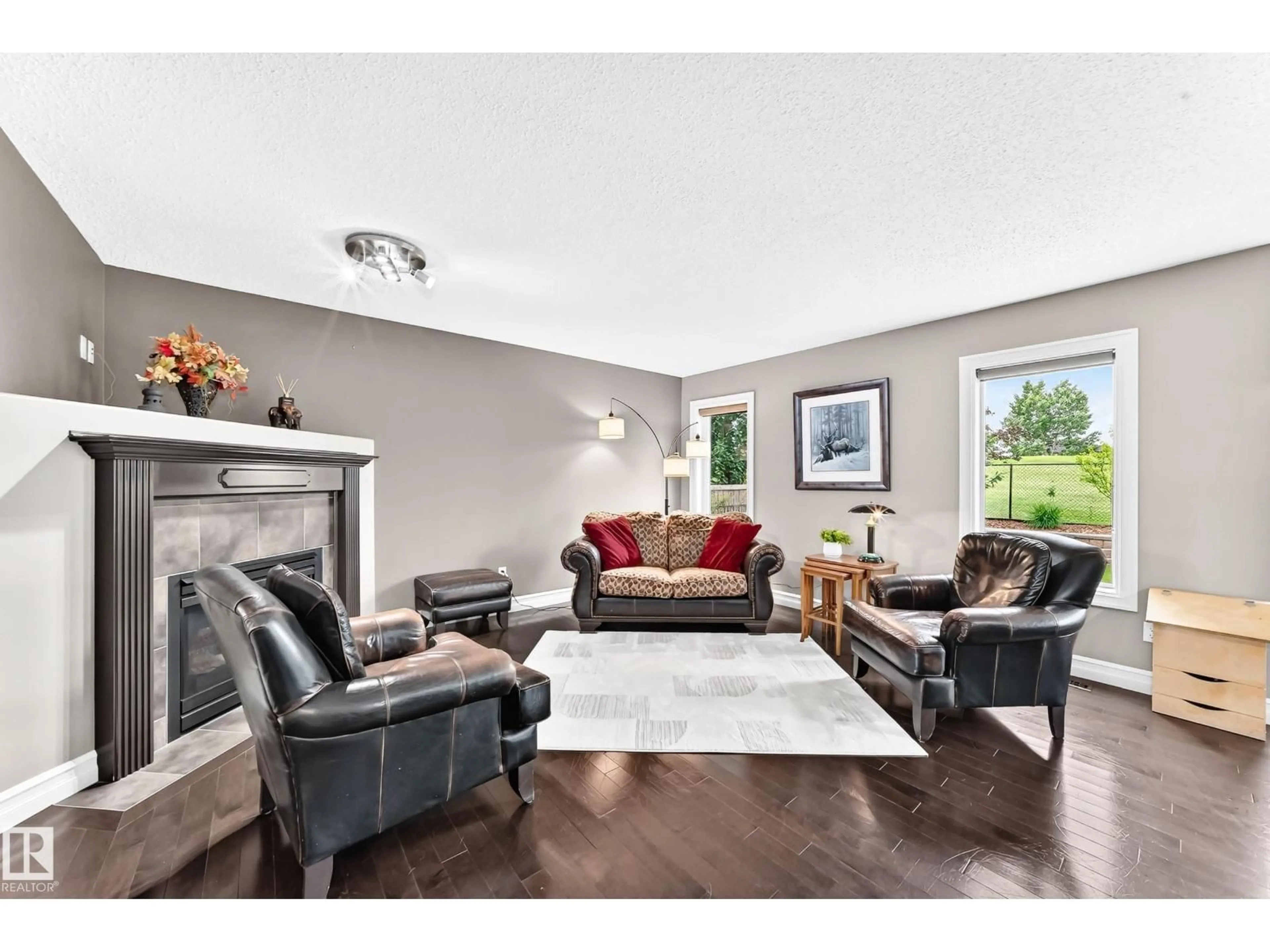 Living room with furniture, wood/laminate floor for 1212 WESTERRA CR, Stony Plain Alberta T7Z0B2