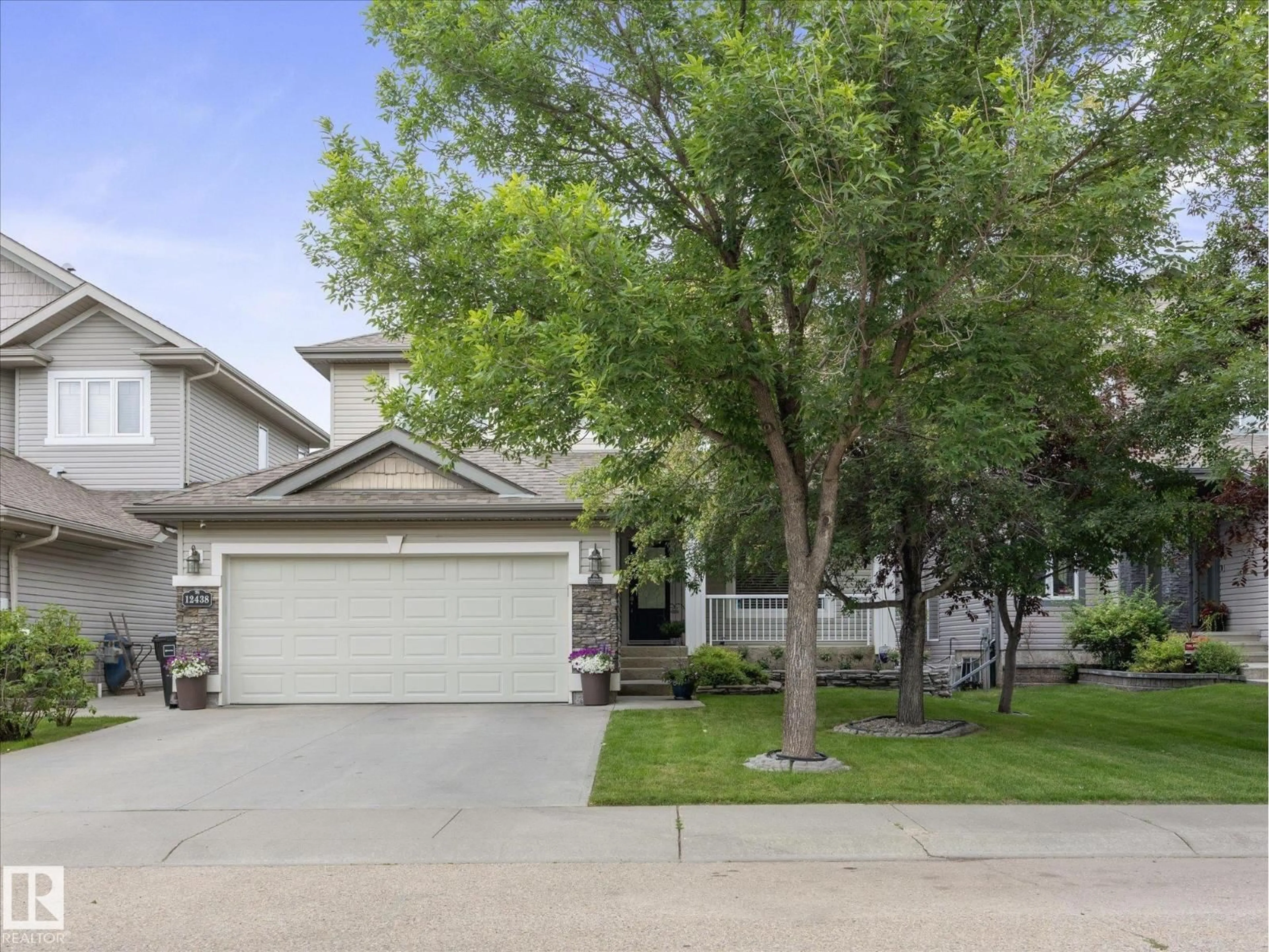 Home with vinyl exterior material, street for 12438 18A AV, Edmonton Alberta T6W1V9