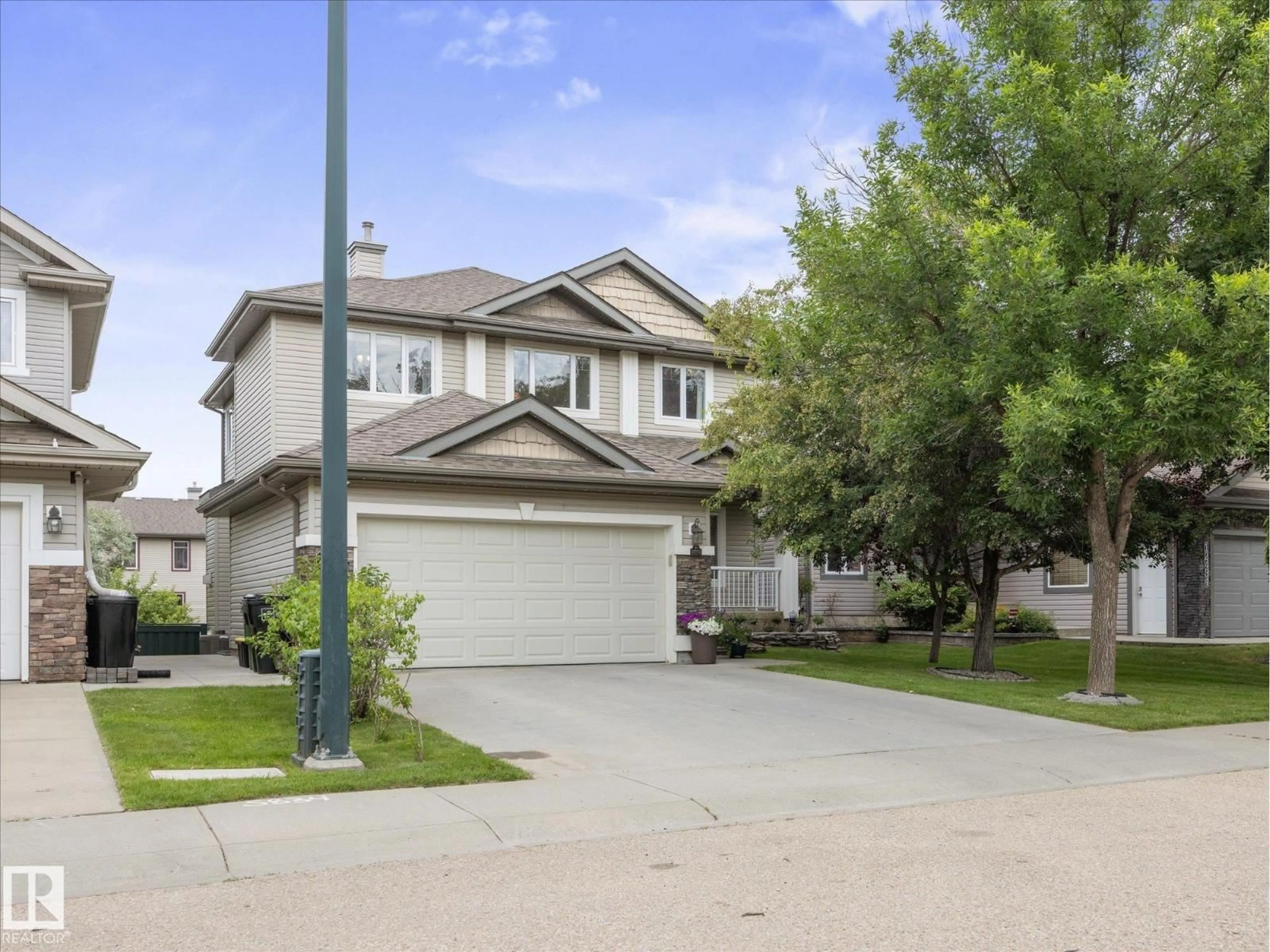 Home with vinyl exterior material, street for 12438 18A AV, Edmonton Alberta T6W1V9