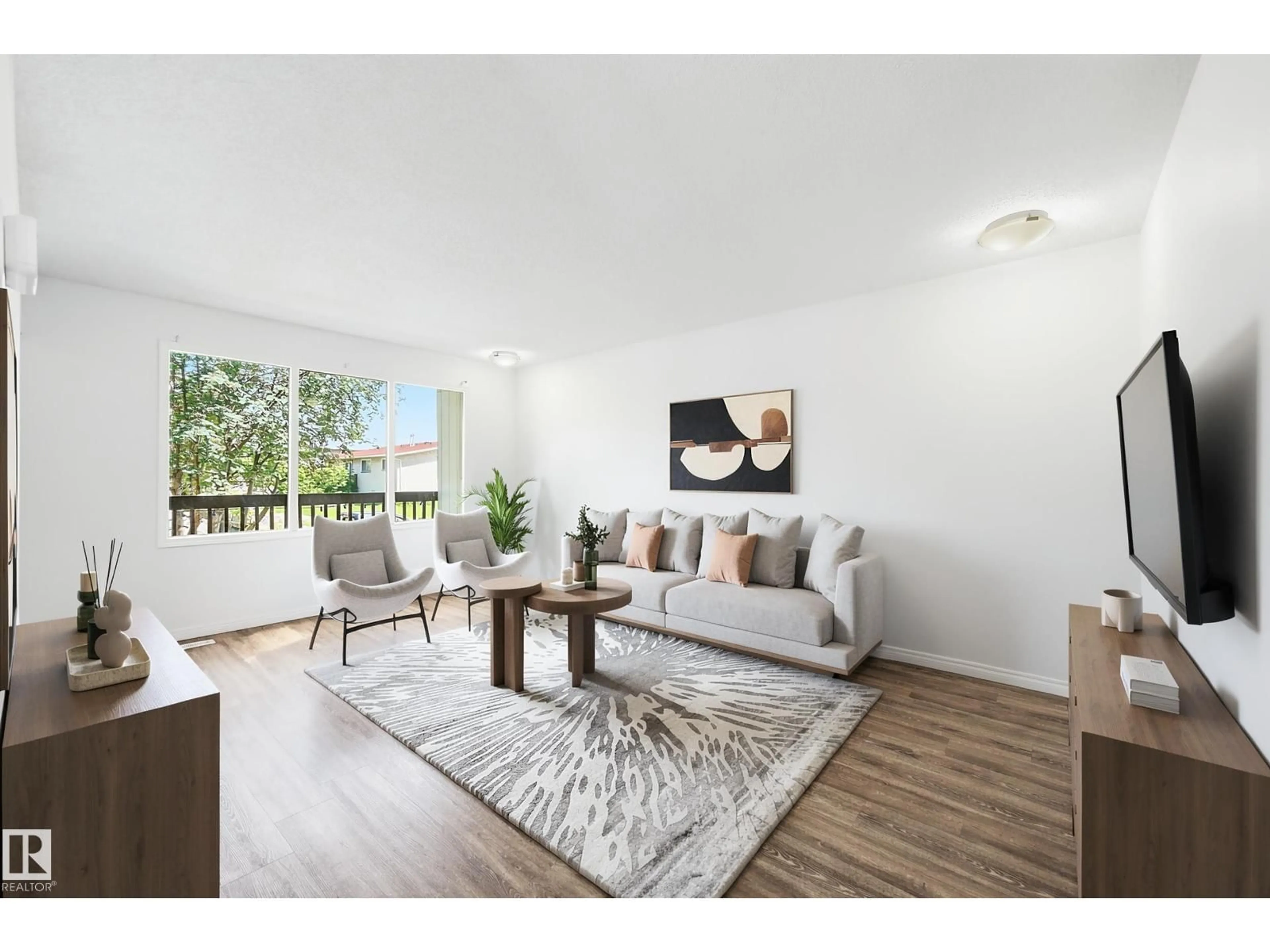 Living room with furniture, wood/laminate floor for 3413 135 AV, Edmonton Alberta T5A2V6