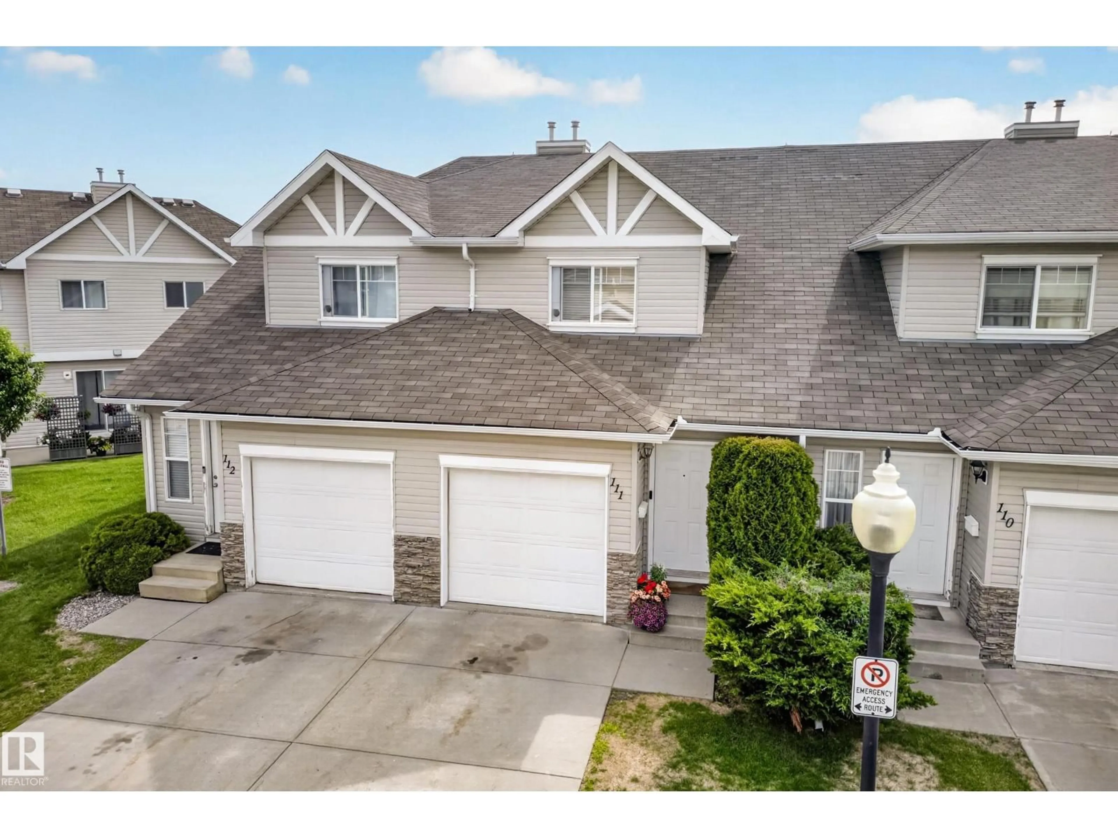 A pic from outside/outdoor area/front of a property/back of a property/a pic from drone, street for #111 - 150 EDWARDS DR, Edmonton Alberta T6X1M4