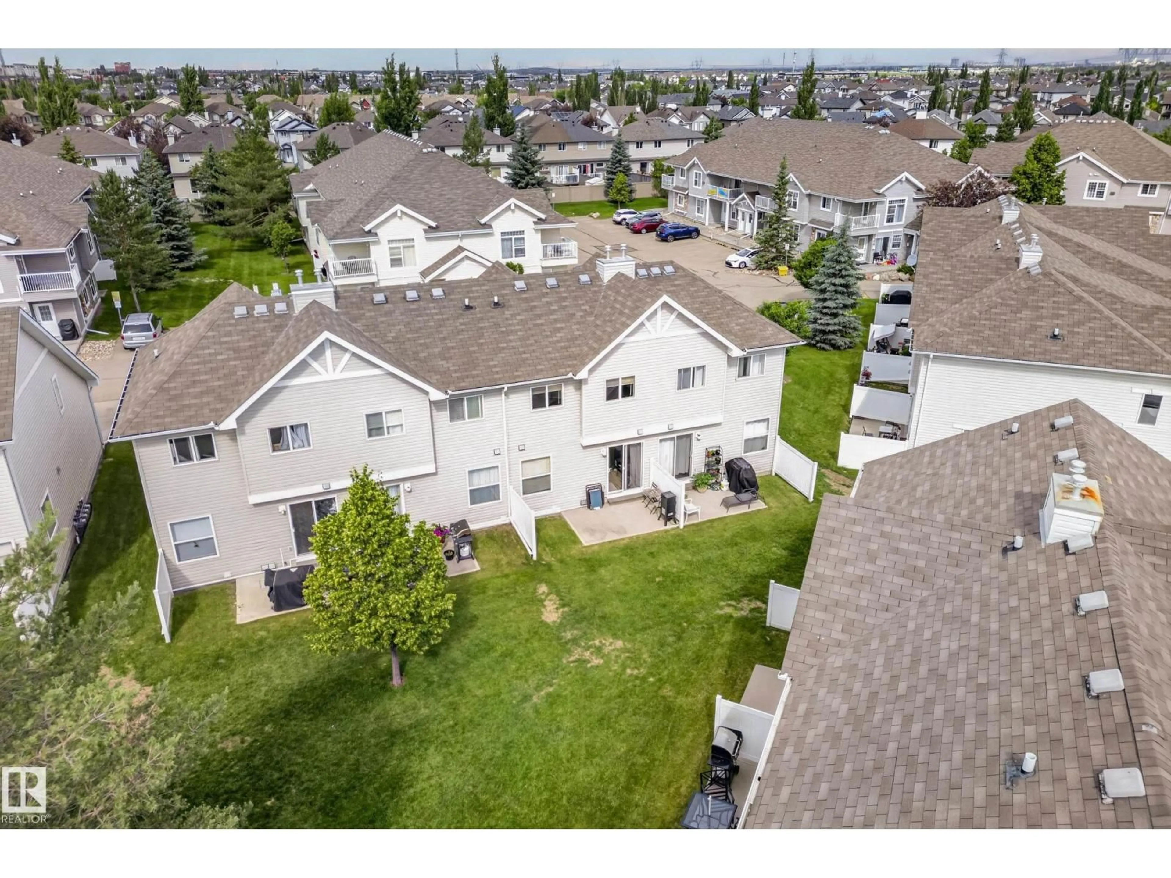 A pic from outside/outdoor area/front of a property/back of a property/a pic from drone, mountain view for #111 - 150 EDWARDS DR, Edmonton Alberta T6X1M4