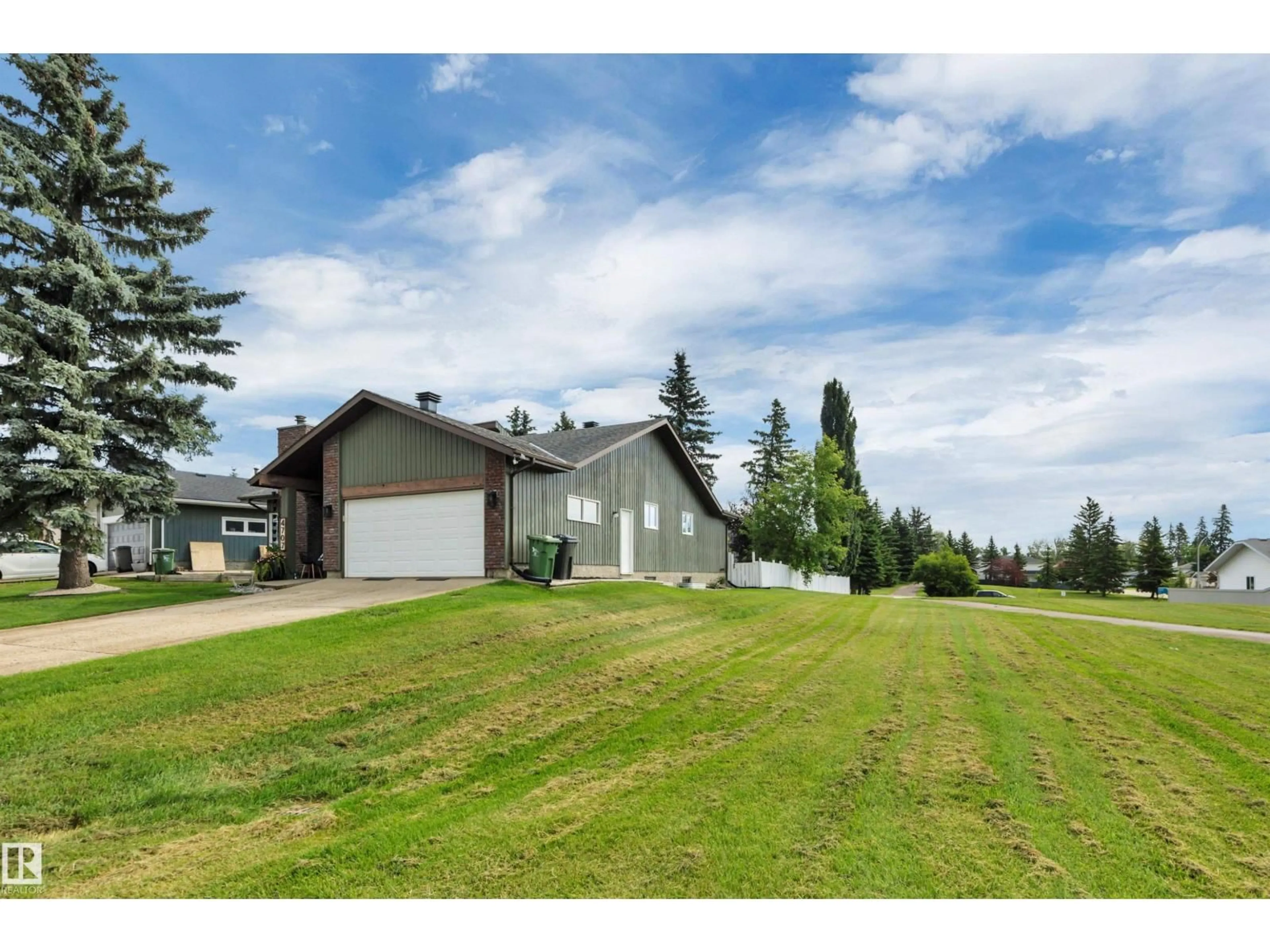 A pic from outside/outdoor area/front of a property/back of a property/a pic from drone, mountain view for 4707 44 ST, Beaumont Alberta T4X1H3