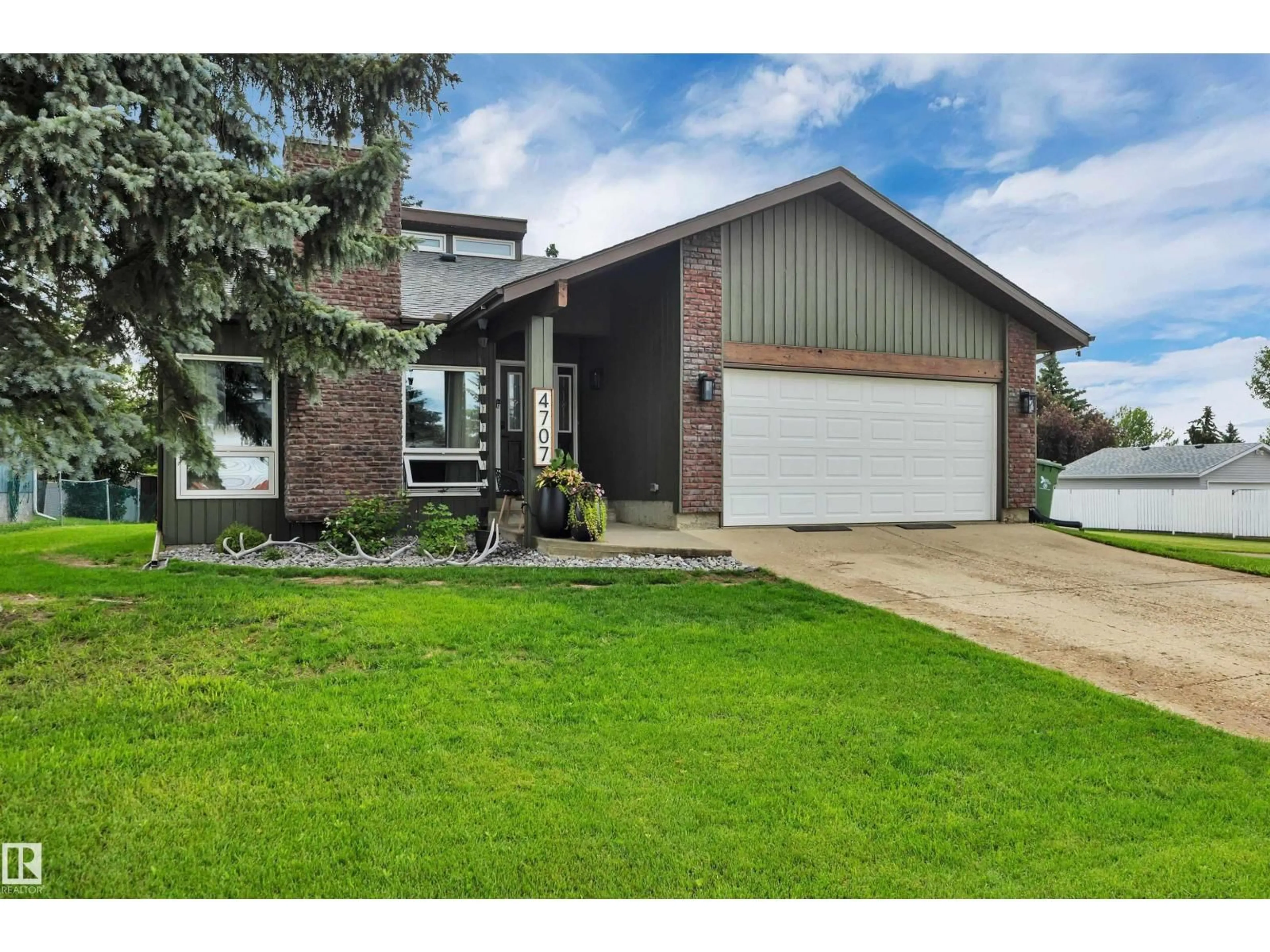 Home with vinyl exterior material, street for 4707 44 ST, Beaumont Alberta T4X1H3