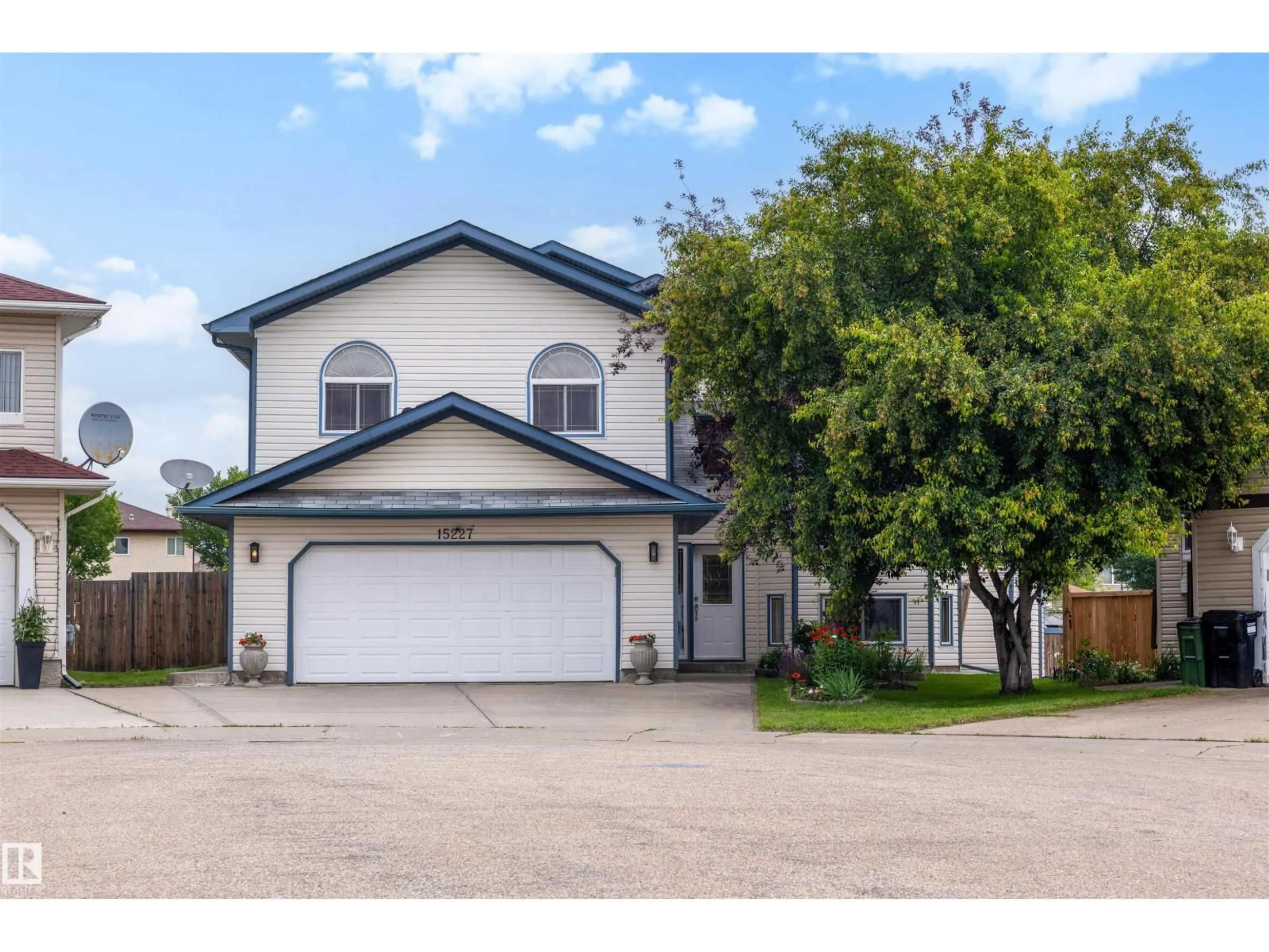 Home with vinyl exterior material, street for 15227 47 ST, Edmonton Alberta T5Y3B7