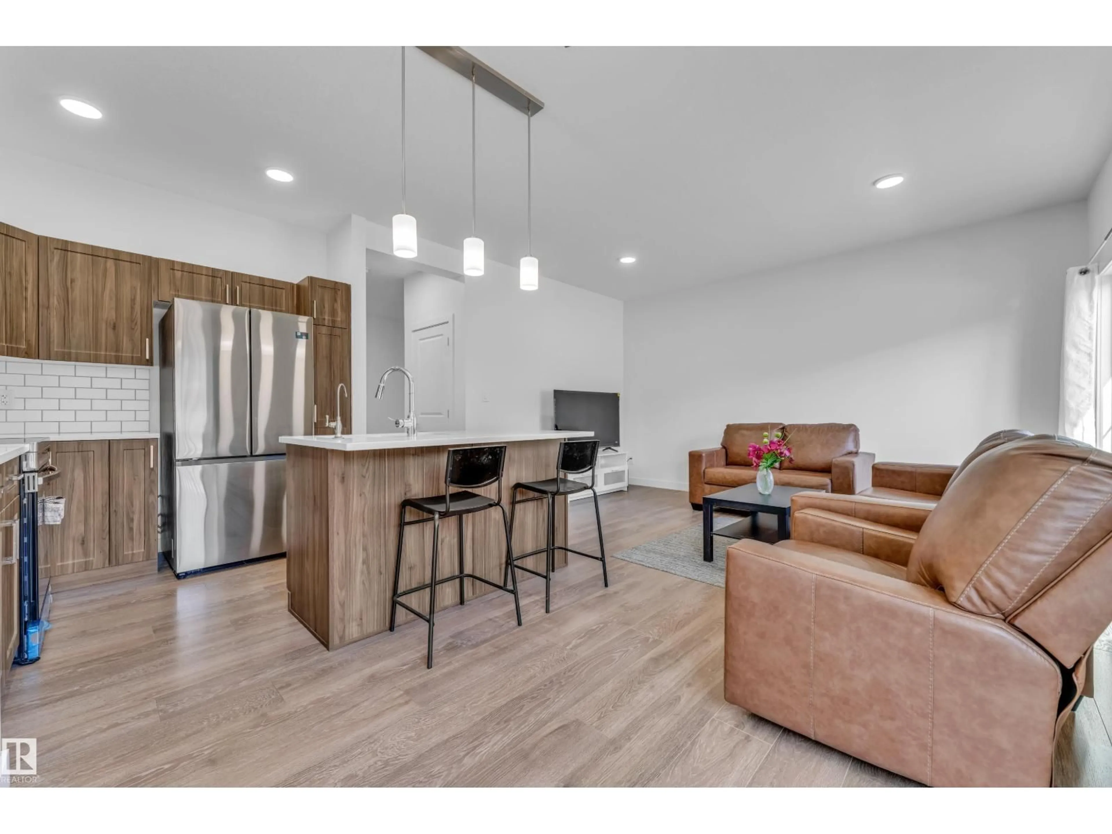Open concept kitchen, wood/laminate floor for #41 - 603 ORCHARDS BV, Edmonton Alberta T6X2W8