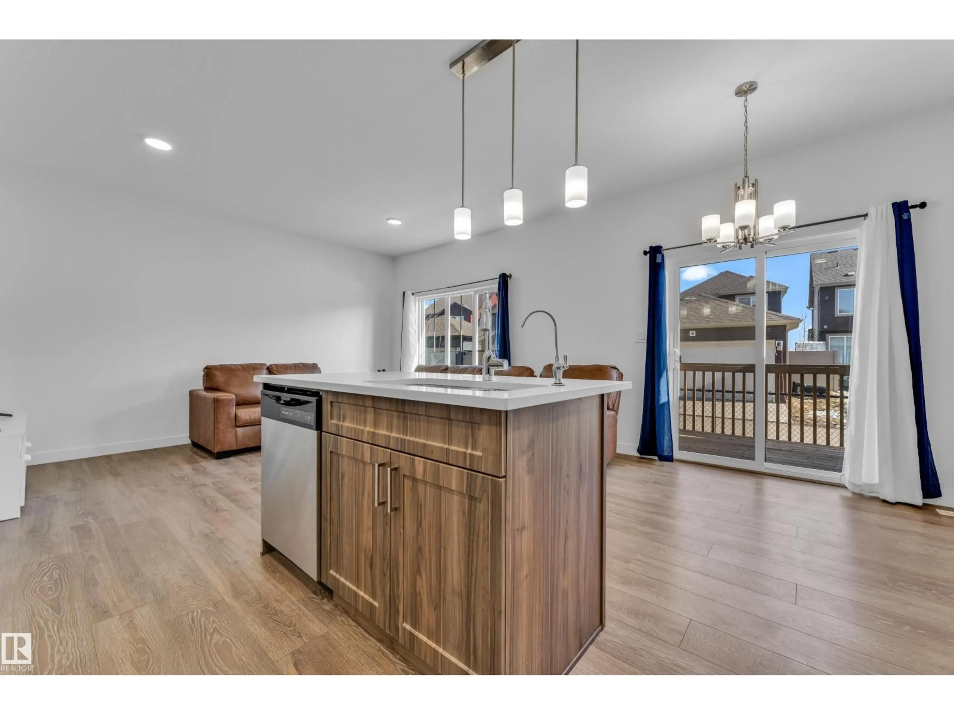 Open concept kitchen, wood/laminate floor for #41 - 603 ORCHARDS BV, Edmonton Alberta T6X2W8
