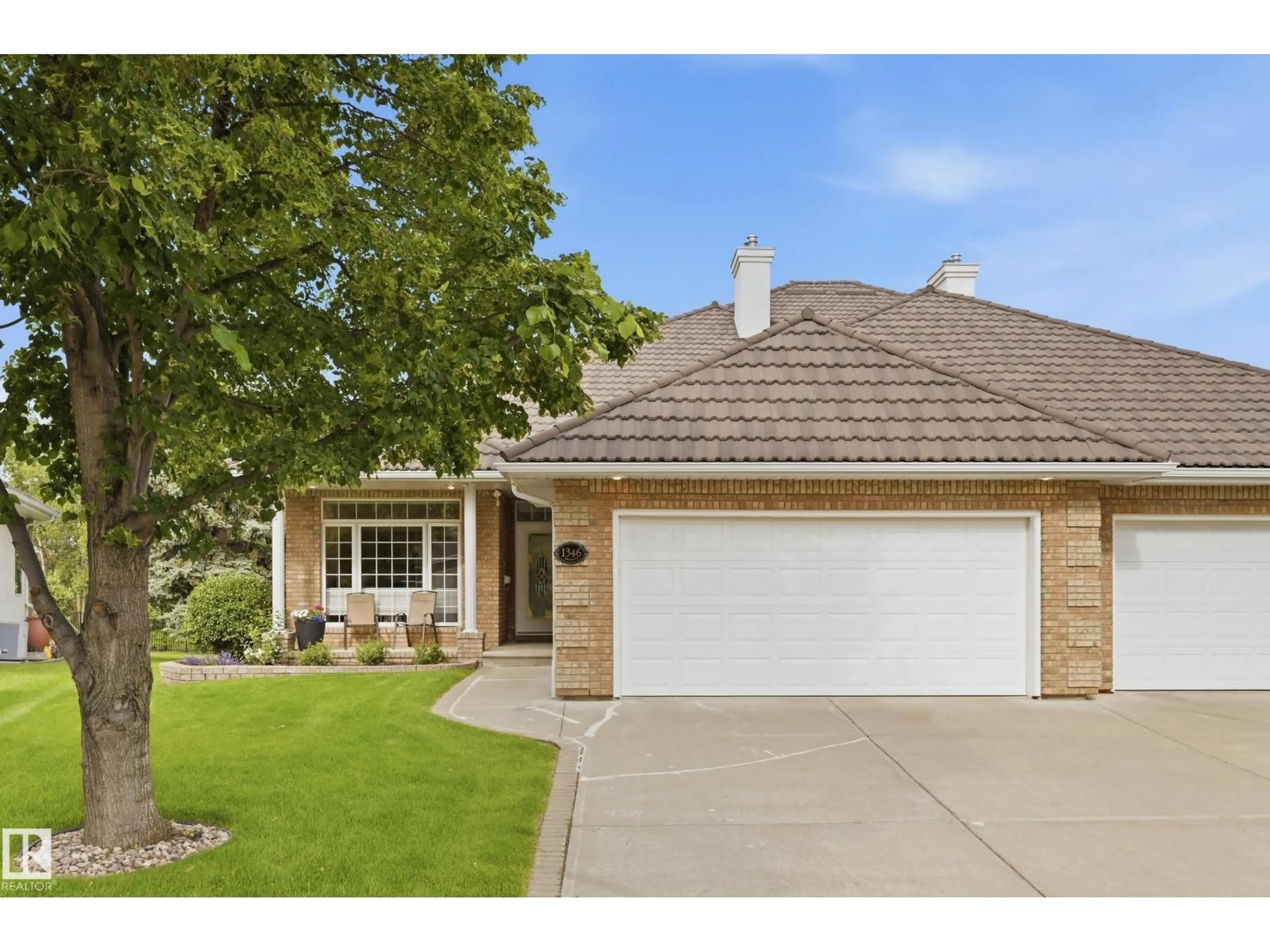 Home with brick exterior material, street for NW - 1346 119B ST, Edmonton Alberta T6J7H5