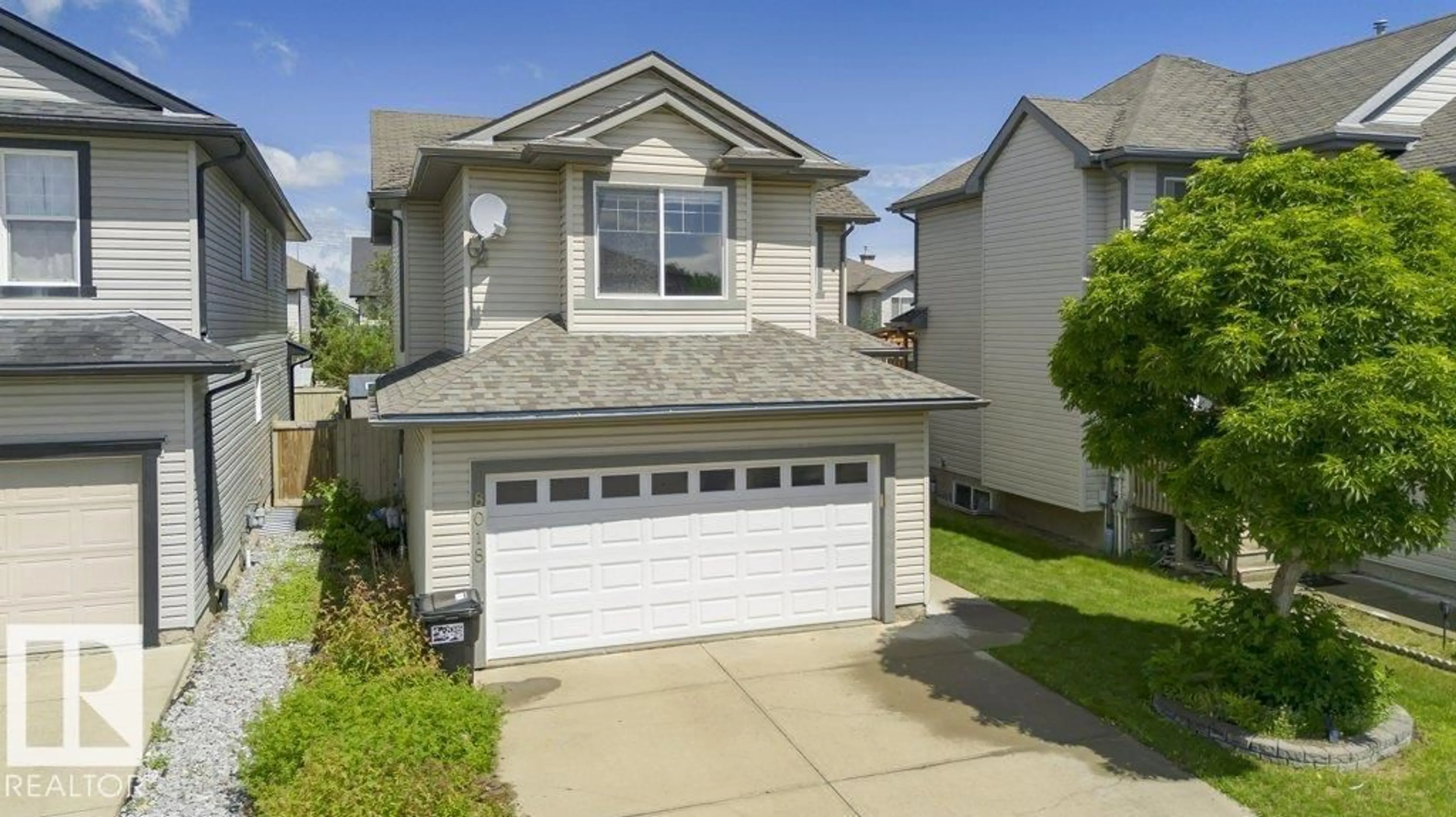 Home with vinyl exterior material, street for 8018 3 AV SW, Edmonton Alberta T6X1K6