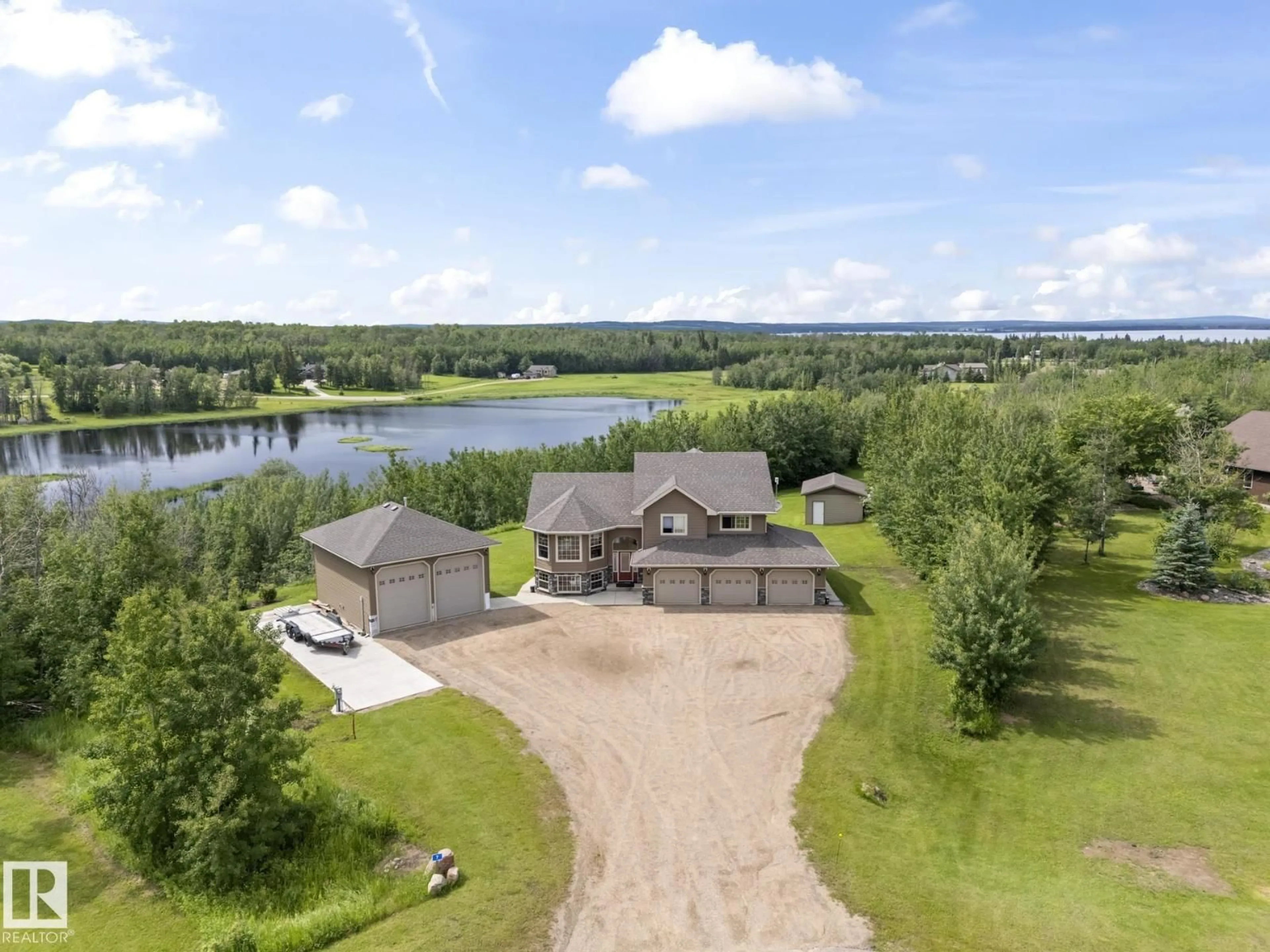 A pic from outside/outdoor area/front of a property/back of a property/a pic from drone, water/lake/river/ocean view for 7 - 61130 465 RGE RD, Rural Bonnyville M.D. Alberta T9N2G9