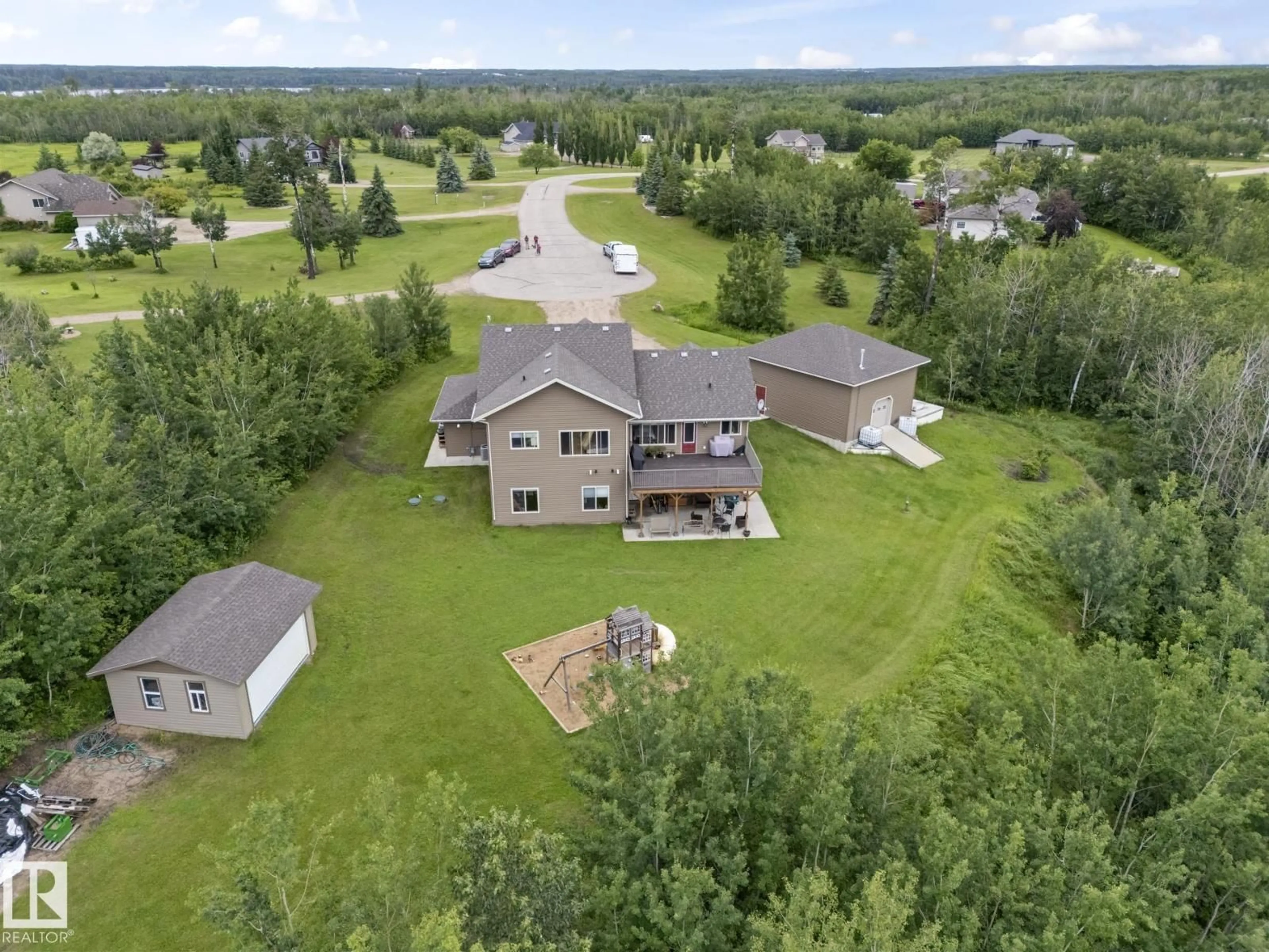 A pic from outside/outdoor area/front of a property/back of a property/a pic from drone, water/lake/river/ocean view for 7 - 61130 465 RGE RD, Rural Bonnyville M.D. Alberta T9N2G9