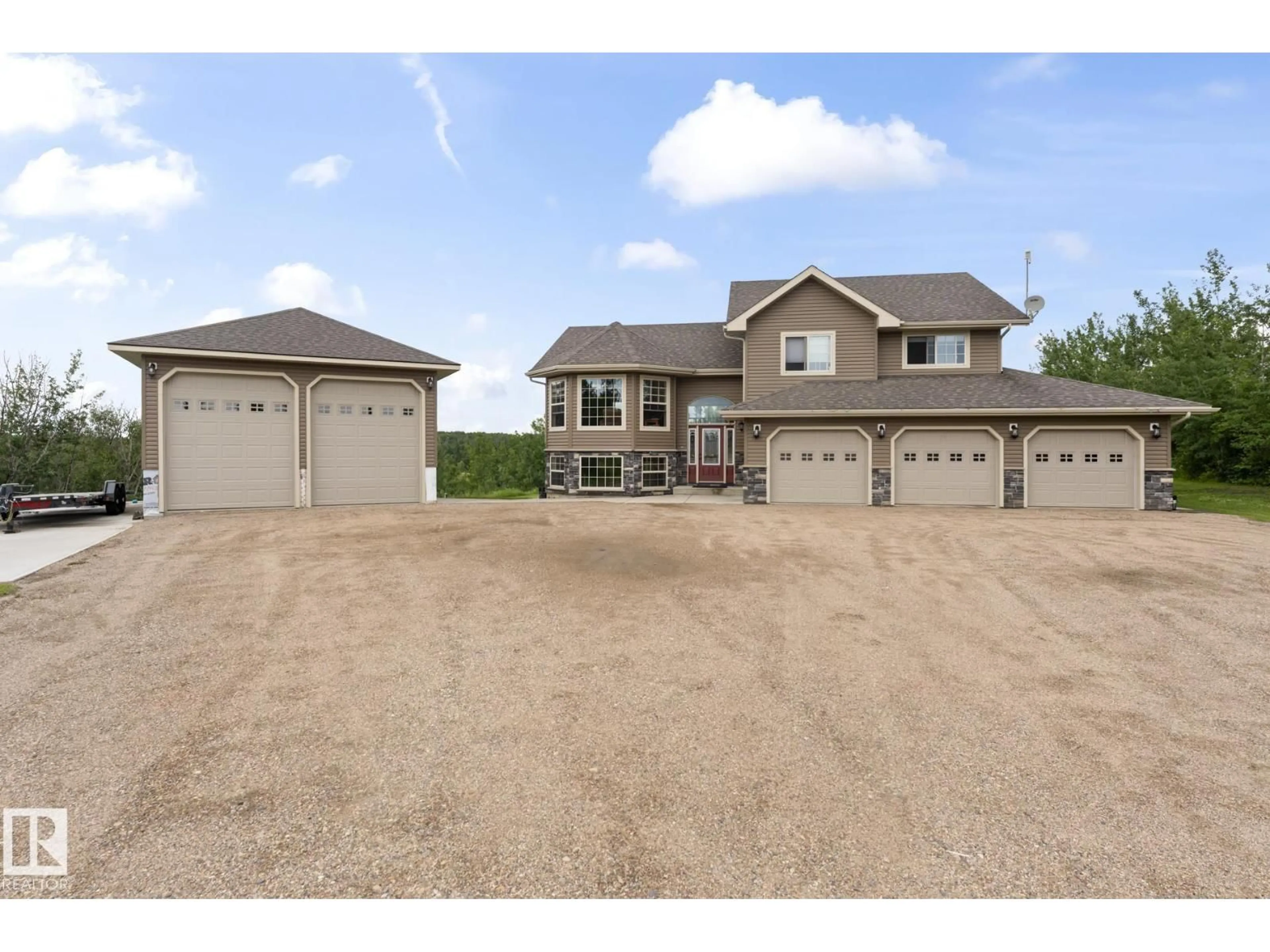 A pic from outside/outdoor area/front of a property/back of a property/a pic from drone, street for 7 - 61130 465 RGE RD, Rural Bonnyville M.D. Alberta T9N2G9