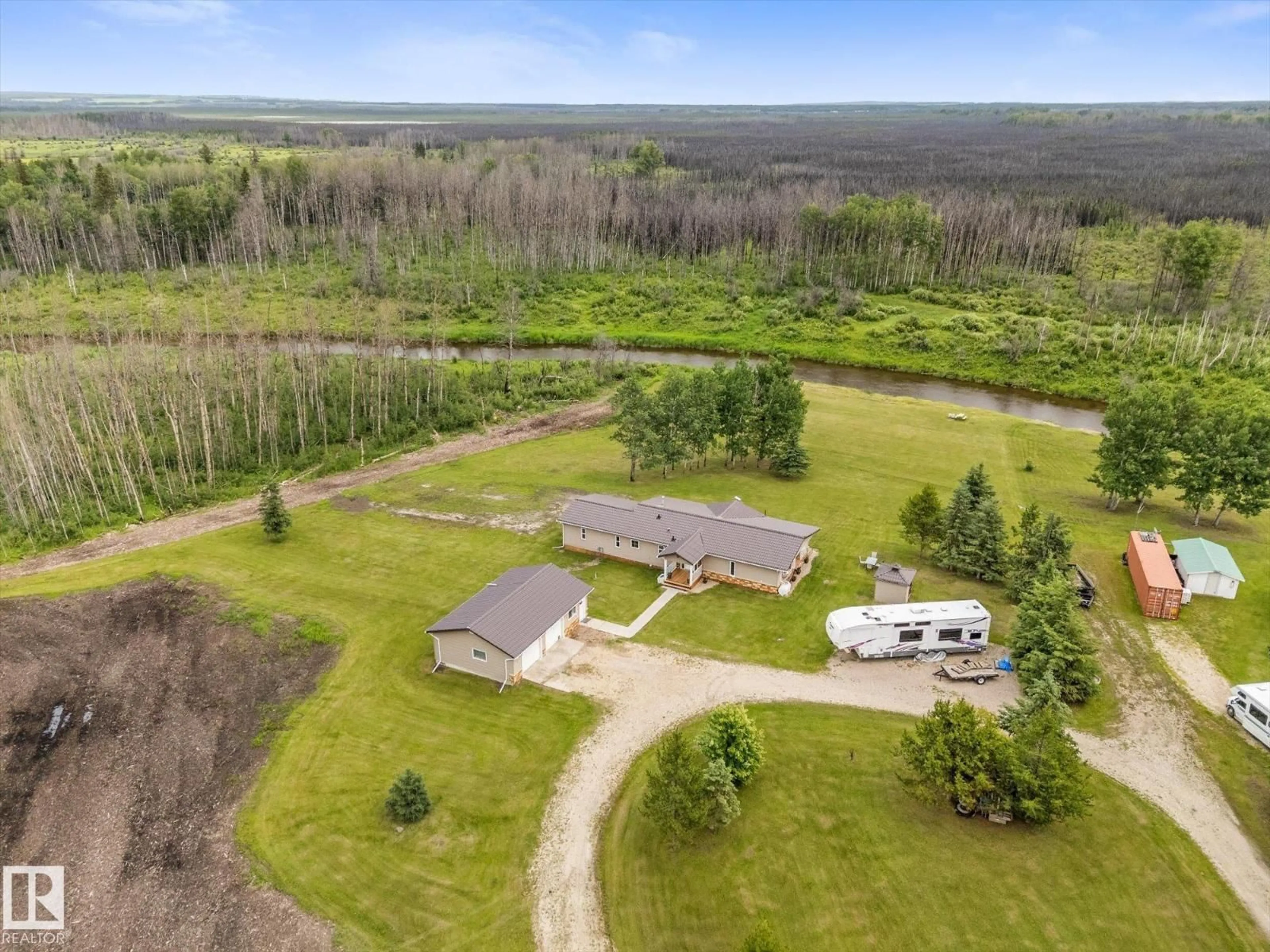 A pic from outside/outdoor area/front of a property/back of a property/a pic from drone, unknown for 9002 - 41 HWY 16, Rural Yellowhead Alberta T0E0T0